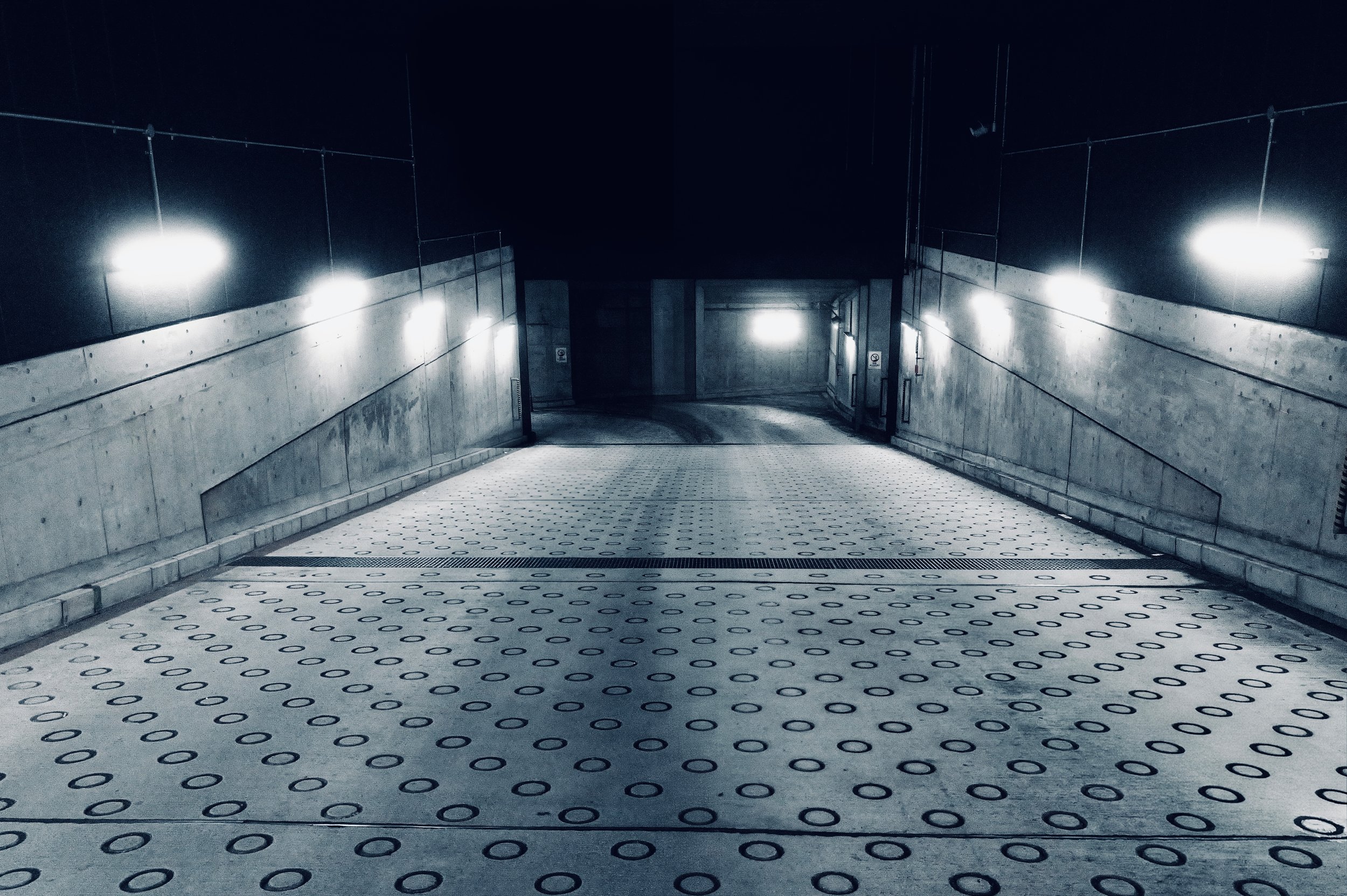 Underground parking entrance ramp with wall lights at Sunshine City Prince Hotel Ikebukuro - Urban fine art night photography