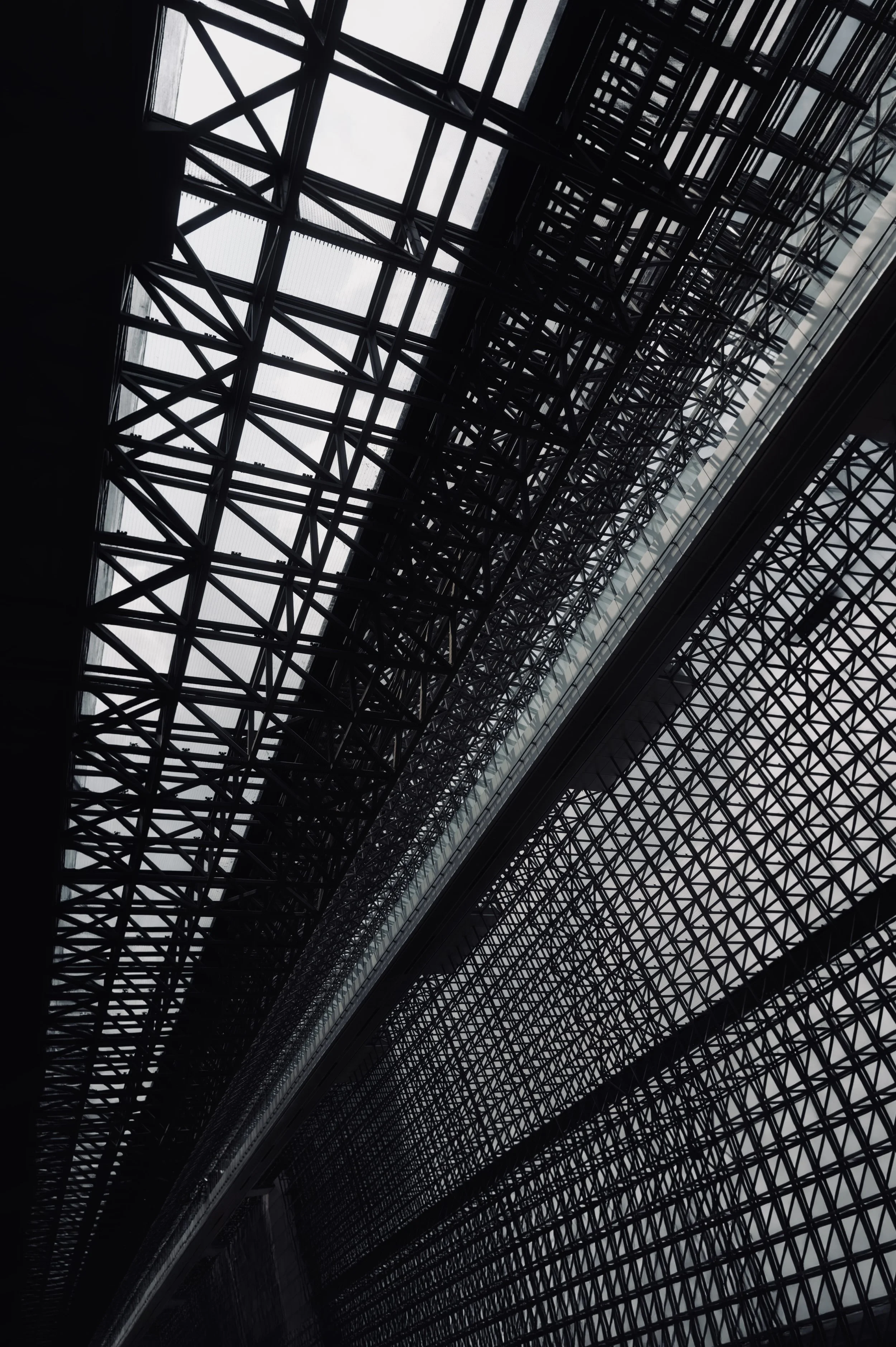 Intricate glass and steel roof matrix at Kyoto Station by Hiroshi Hara - Futuristic architectural fine art photography
