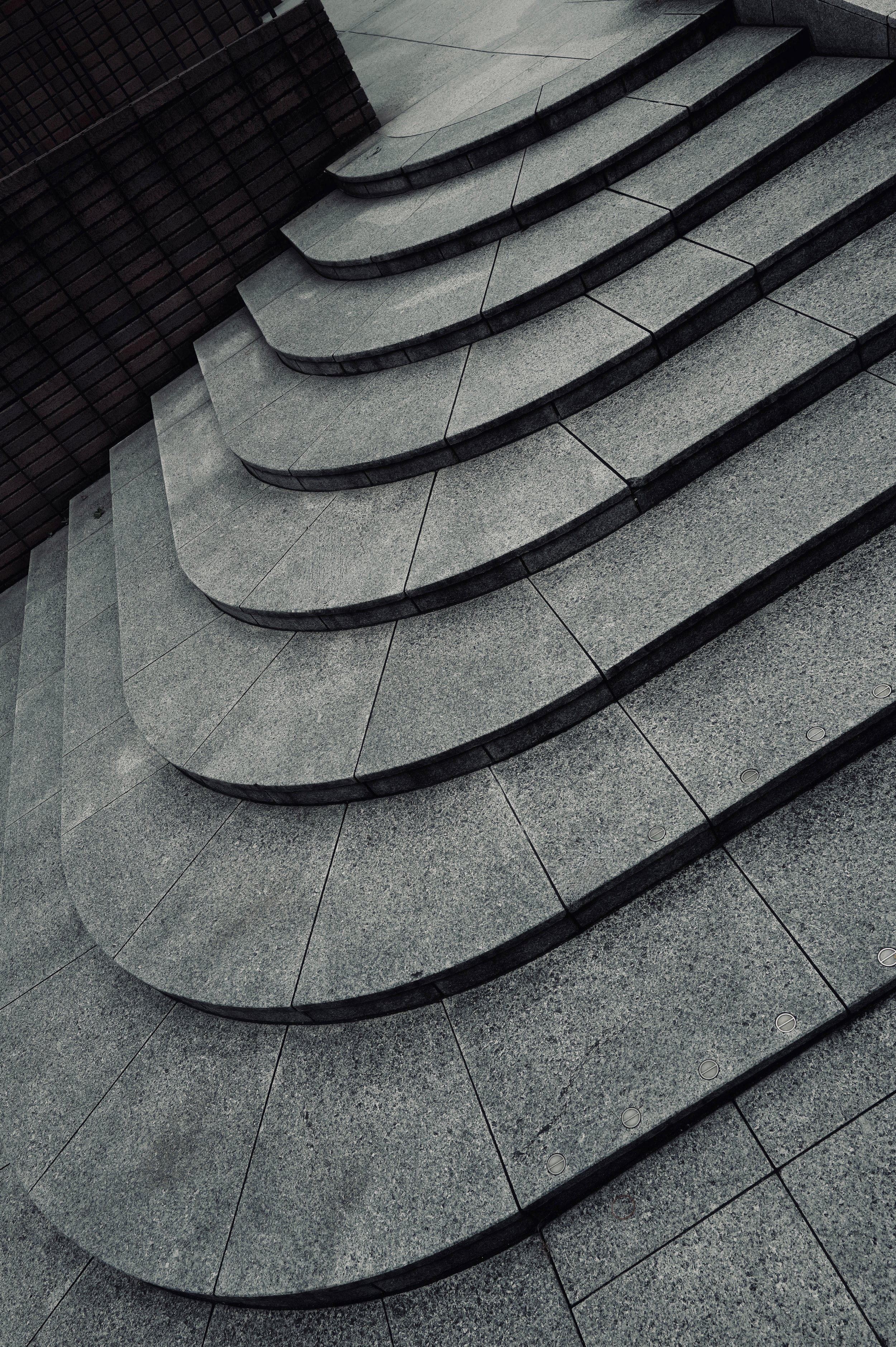 Curved concrete staircase with geometric stone steps - Fine art architectural photography