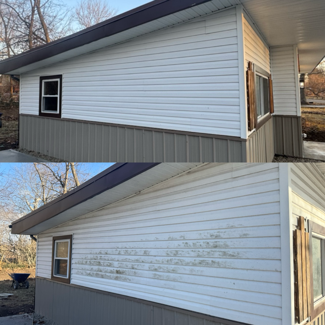 Side view of a house with white and beige vinyl siding, showing a window and weathered exterior with dirt and grime.