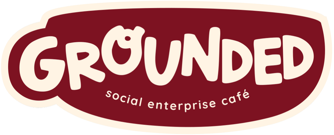 Logo of Grounded Social Enterprise Café with brown background and white text.