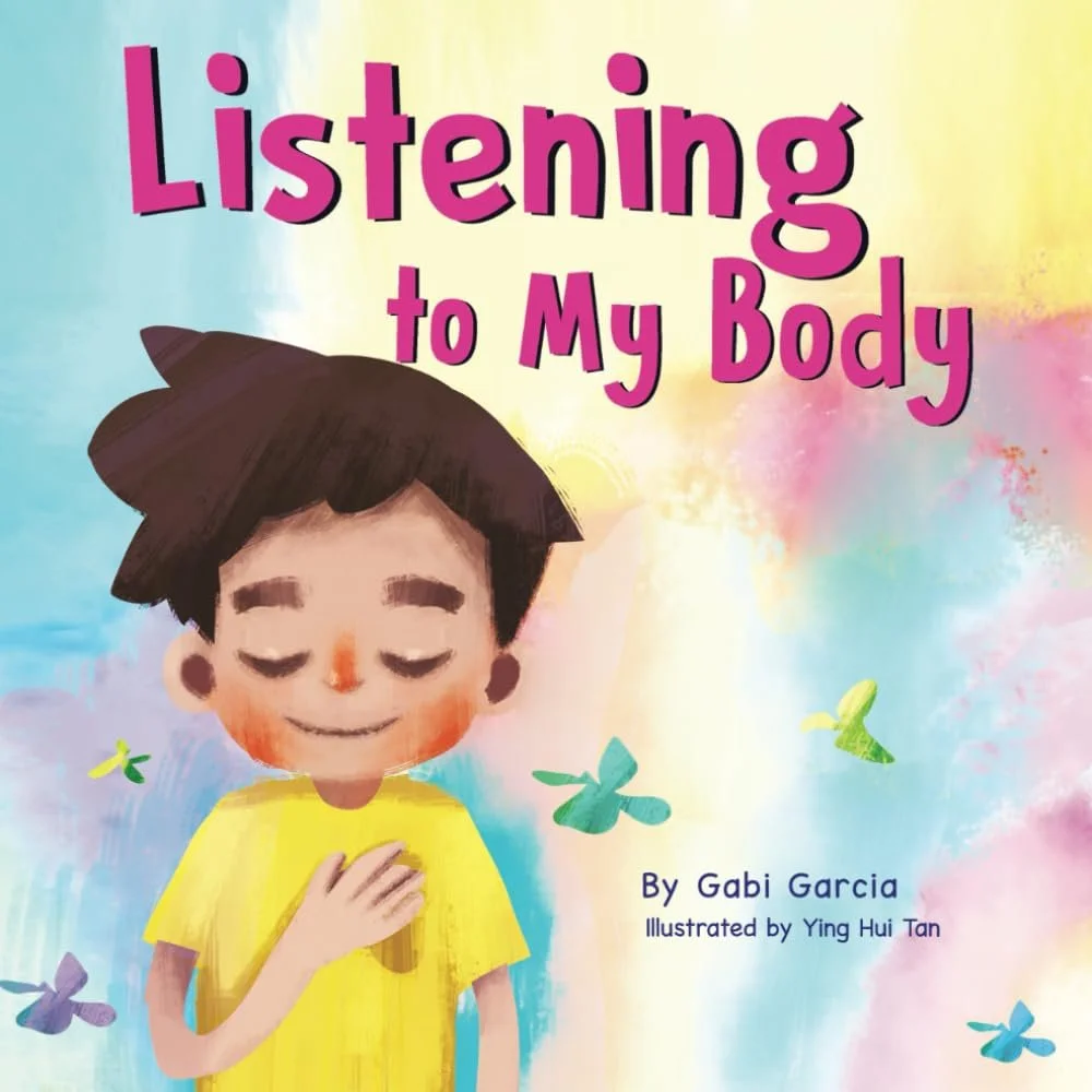 Cover of a children's book titled "Listening to My Body" by Gabi Garcia, illustrated by Ying Hui Tan, featuring a smiling boy with closed eyes, holding his chest, against a colorful pastel background with floating butterflies.