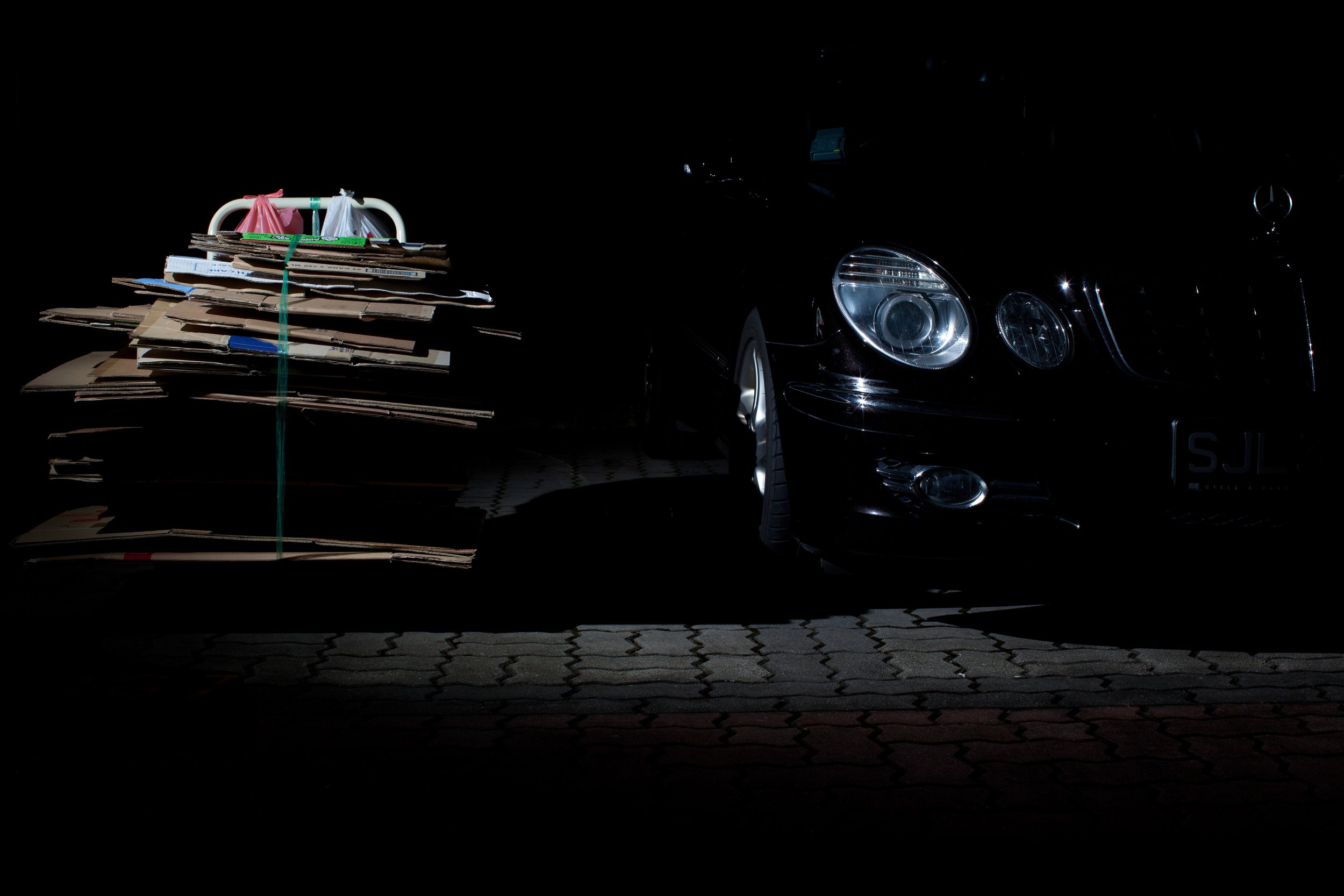 37_Retiring On An Unbalanced Seesaw - Cardboard Boxes and Mercedes.jpg