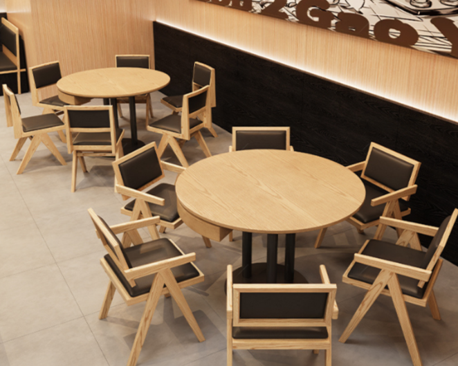 Two round wooden tables with eight wooden chairs in a modern indoor setting.