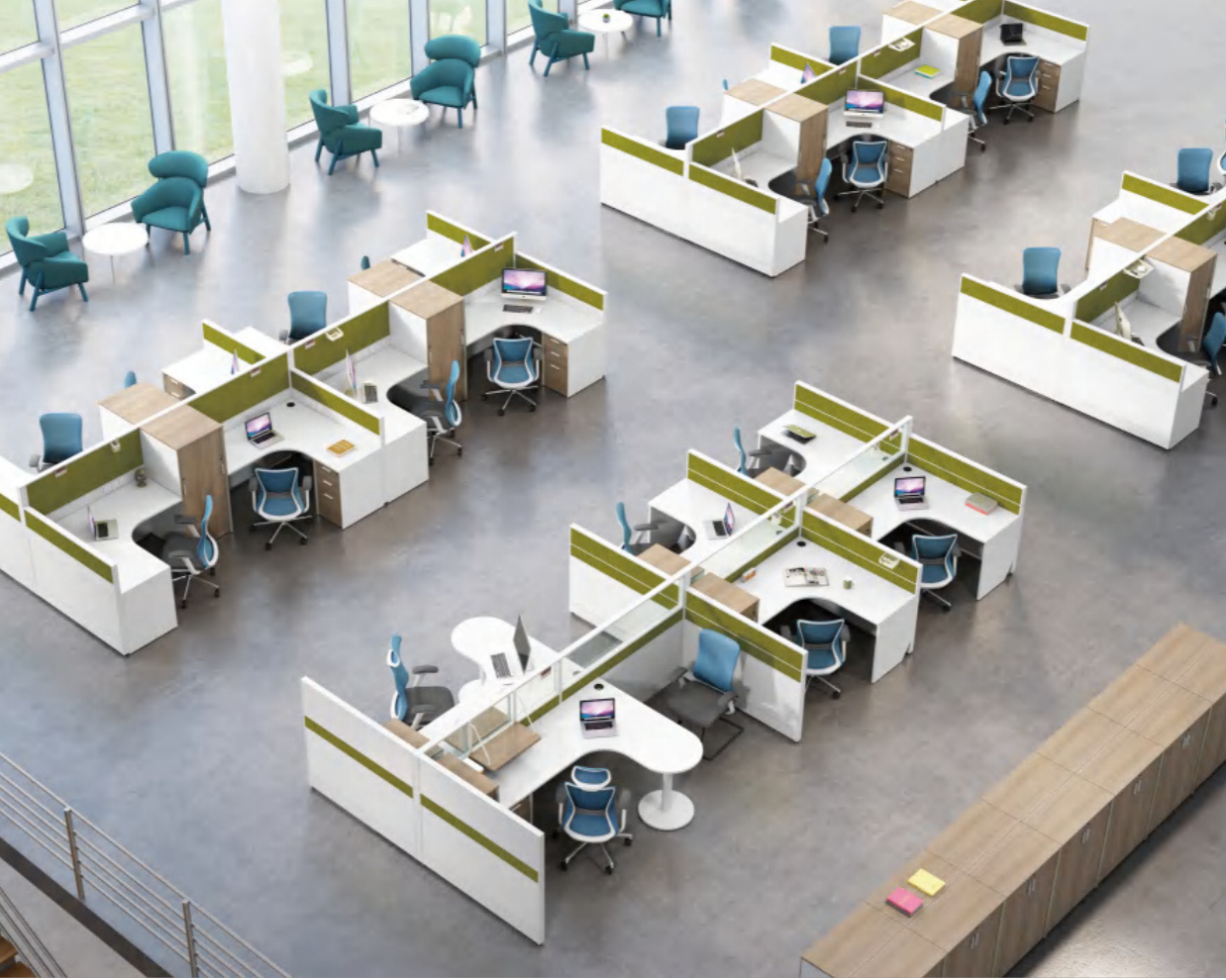 An open-plan office with multiple cubicles, blue office chairs, and computers. There are seating areas with green chairs and small tables near large windows.