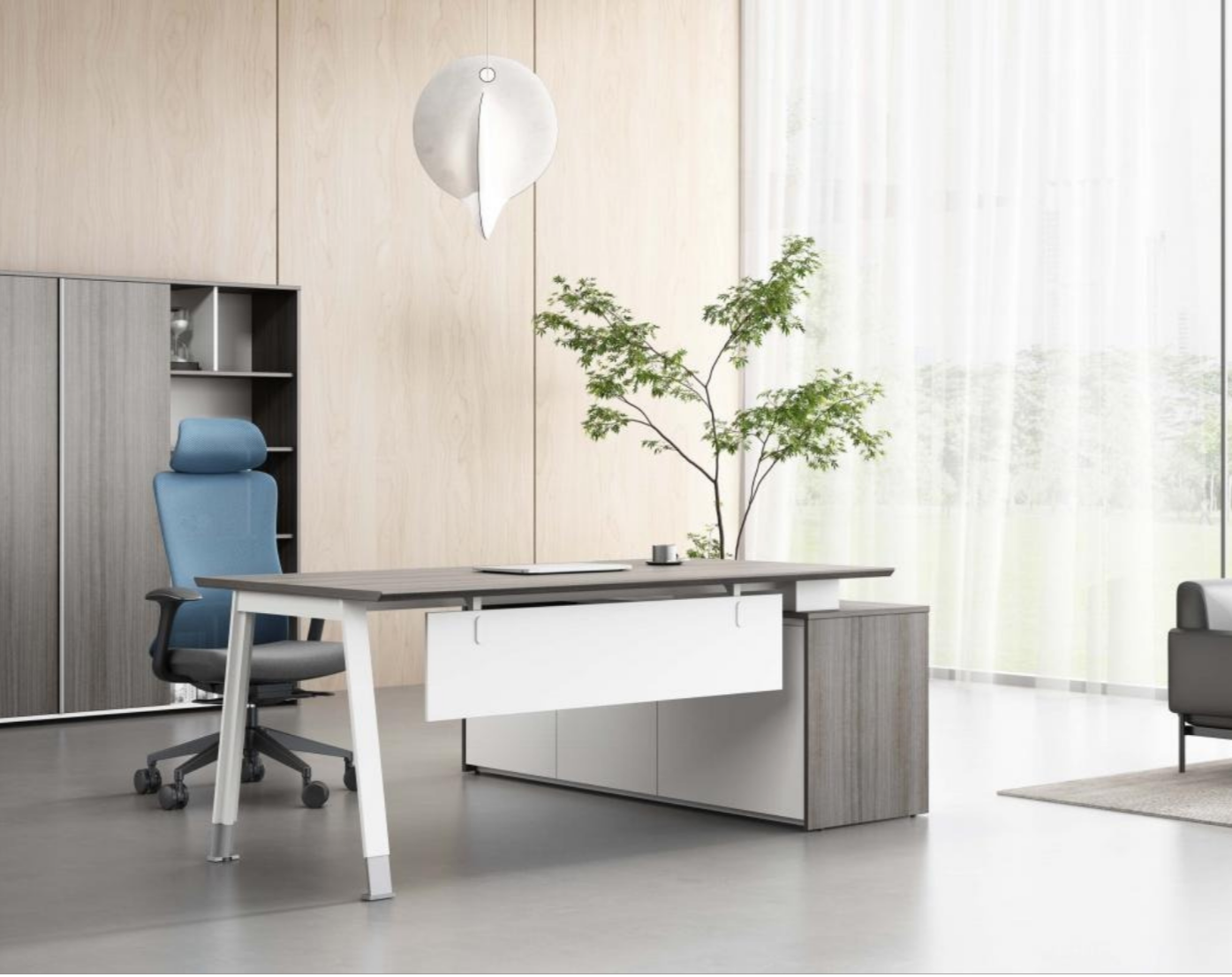 Modern office with a light wood wall, a large window with sheer curtains, a blue ergonomic office chair, a white and gray desk with a small plant, and decorative wall art resembling leaves.