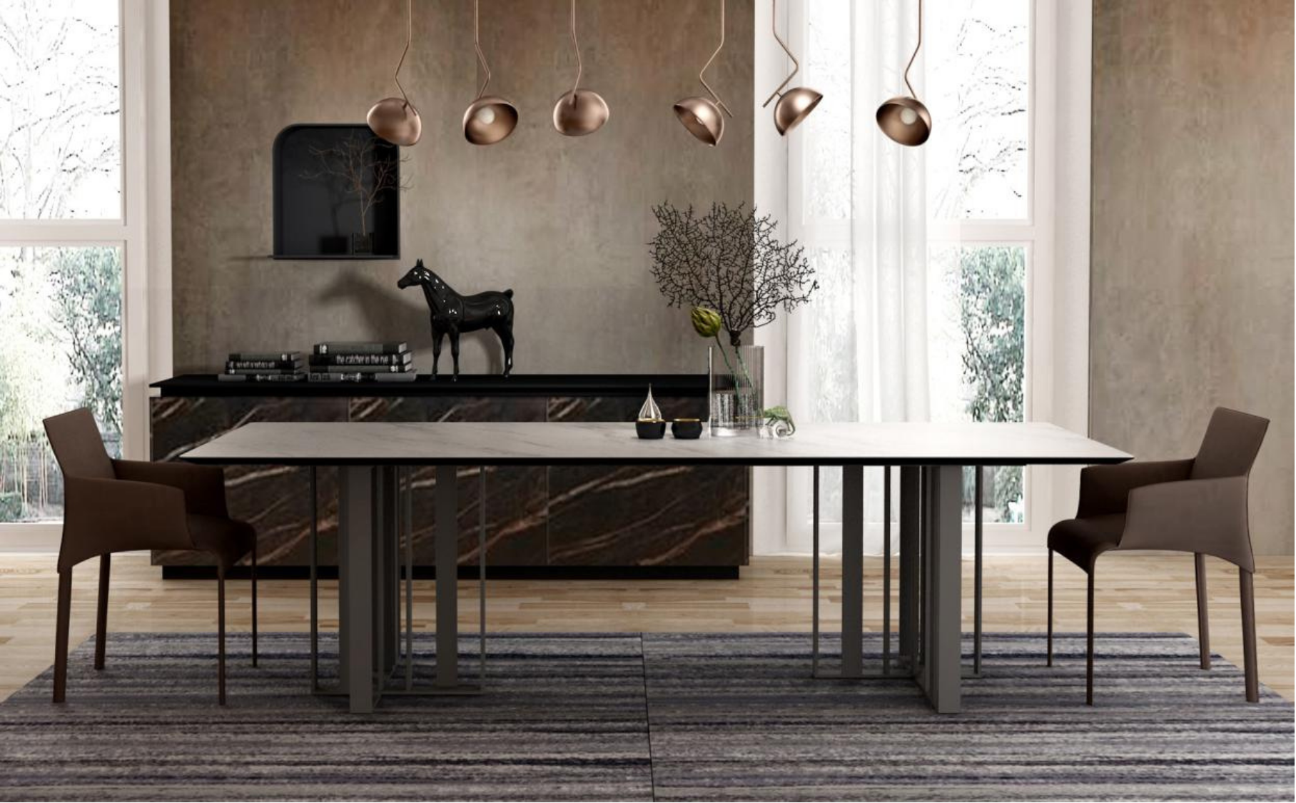 Modern dining room with a large white marble table, two brown chairs, and a black sideboard with decorative items. Large windows with sheer curtains allow natural light, and a set of copper pendant lights hangs above the table. The decor includes a black horse sculpture, books, and vases with branches and flowers.