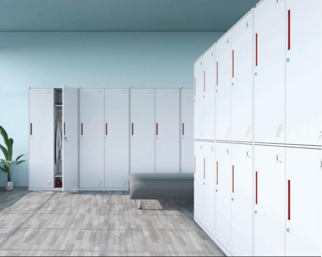 A row of white lockers with red handles in a locker room, with a gray bench and a potted plant nearby.