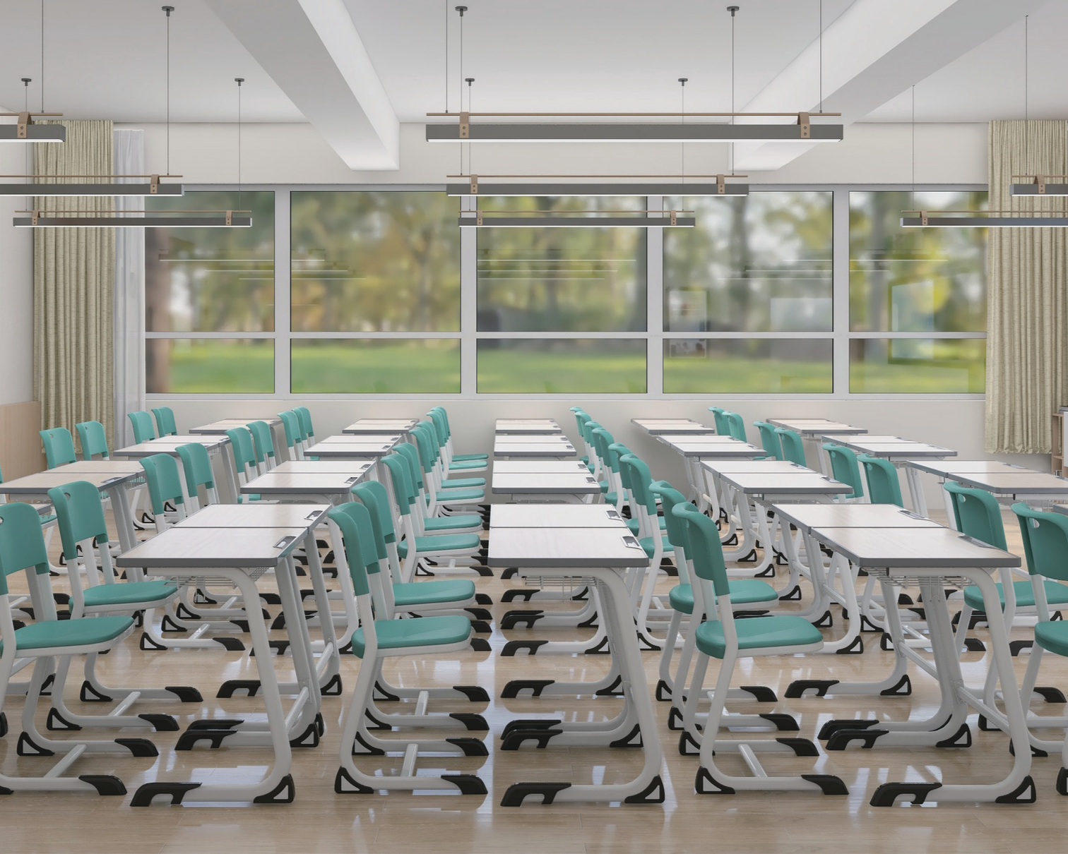 A classroom with rows of white desks and teal chairs, large windows showing trees outside, ceiling lights, and beige curtains.