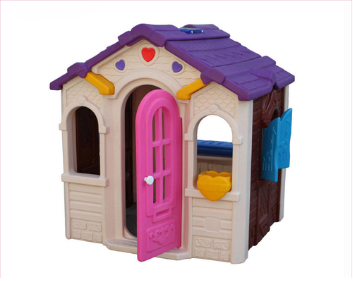 Children's plastic playhouse with a pink door, purple roof, and a yellow heart-shaped detail