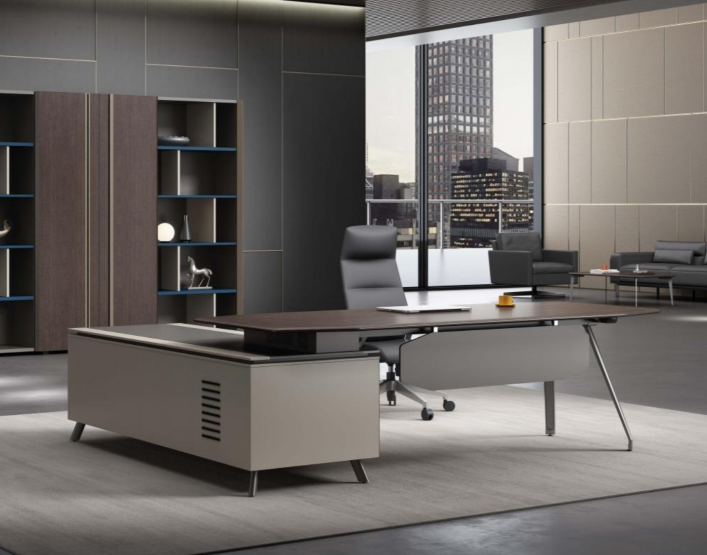 Modern office space with a large wooden desk, black leather chair, gray sofa, and floor-to-ceiling windows showing a city skyline.