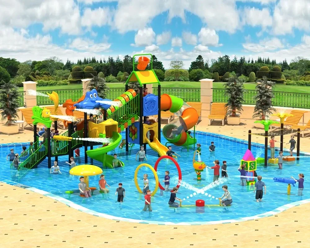 Children playing in a colorful water park with slides, water sprayers, and fountains, surrounded by benches and greenery.