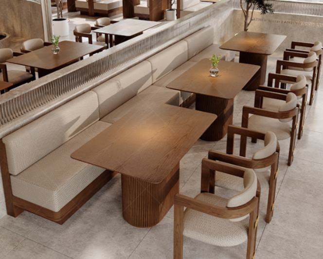 Empty wooden and upholstered seating area in a restaurant or hotel dining space with small potted plants on the tables.