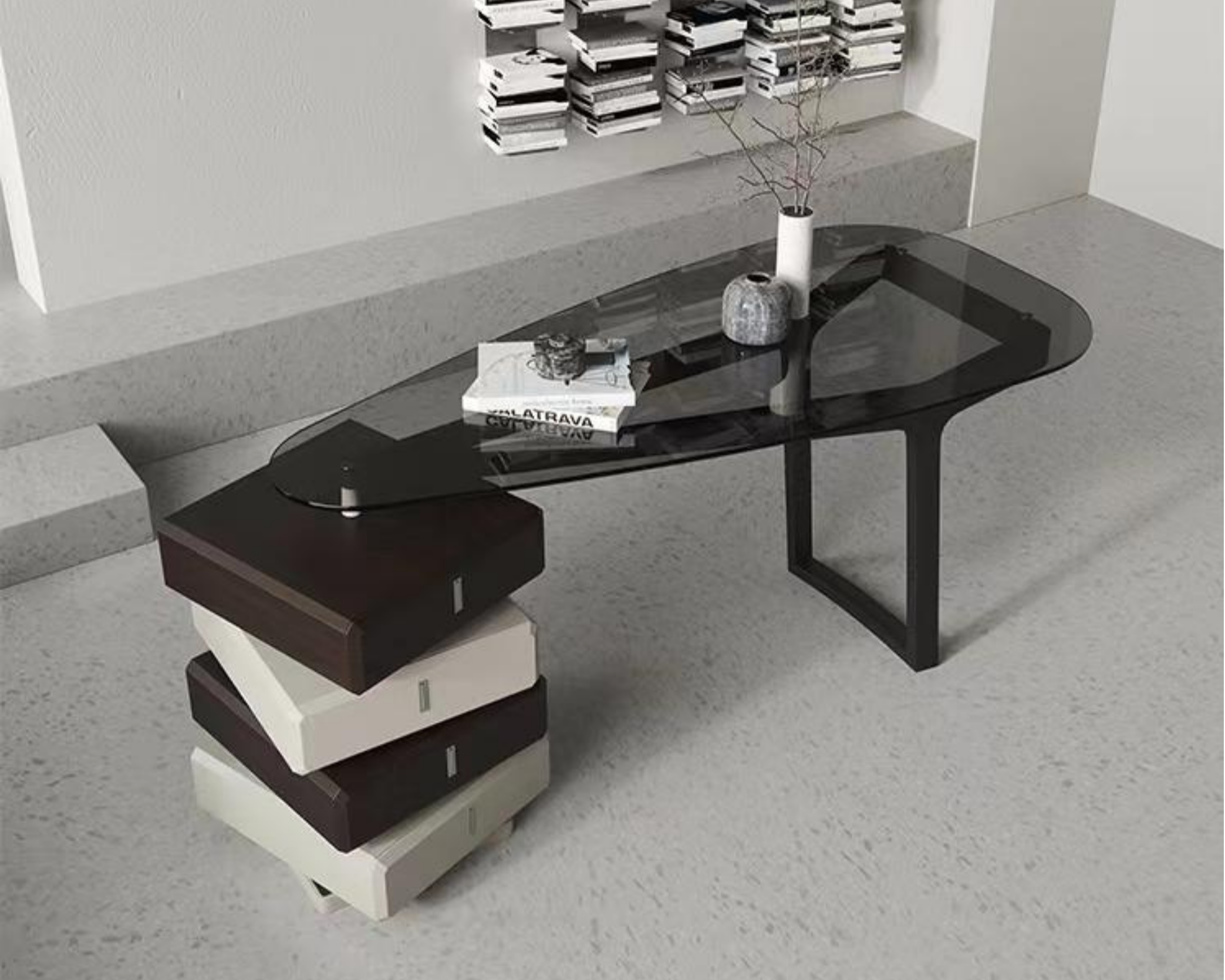 Modern black coffee table with a glossy surface, placed in front of a white wall with a grey textured countertop and a wall-mounted bookshelf filled with books. Decor items on the table include a white book, a glass mug, and two vases, one large and round, another tall and slim with some dried branches. The background features a minimalistic and stylish interior design.