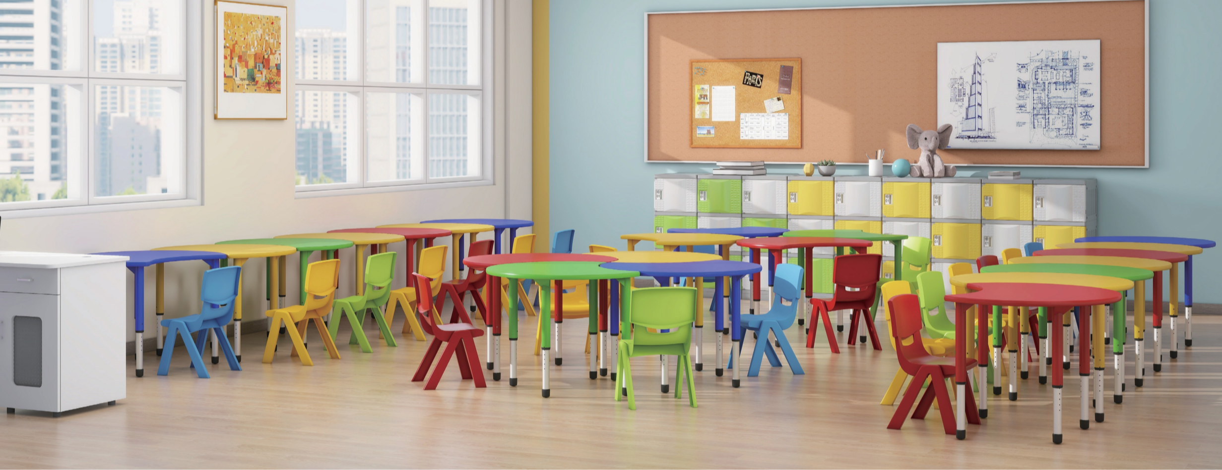 Colorful classroom with round and rectangular tables and chairs in red, yellow, green, and blue, set near large windows with city skyline view, beige flooring, bulletin board, lockers, and a stuffed animal on top.