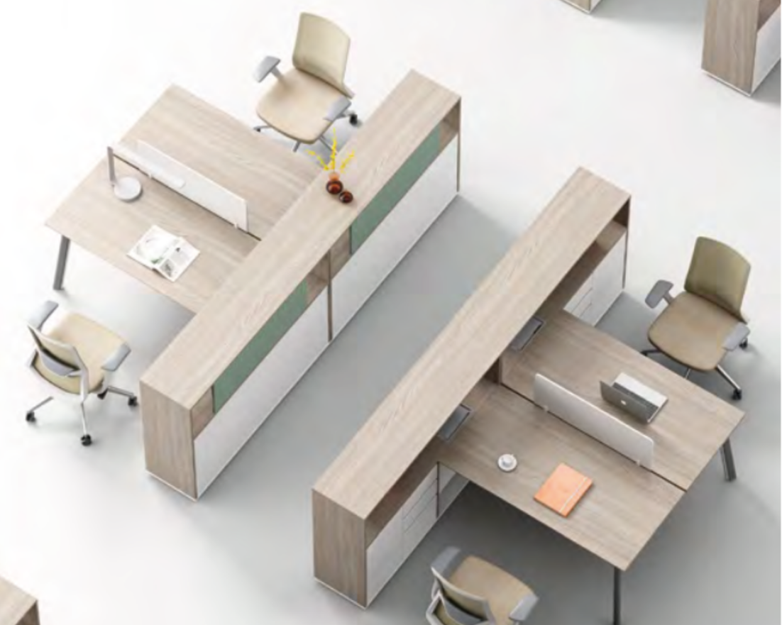 Office desks with beige chairs, open books, a laptop, and a vase with yellow flowers.