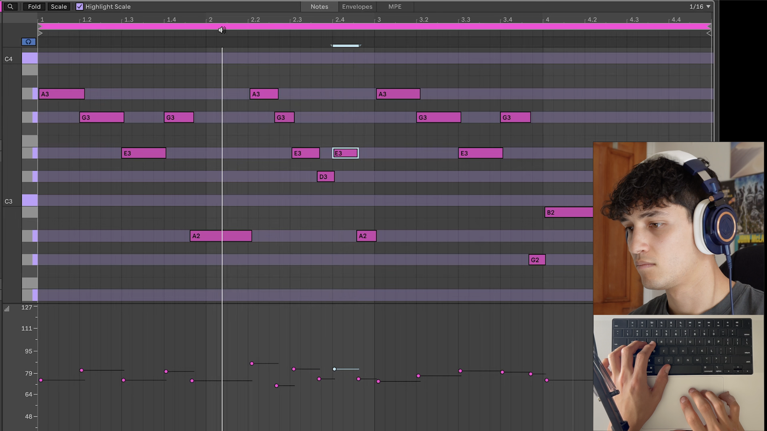 A person wearing headphones is looking at a computer screen with audio editing software open, and there is a small inset image of the person holding a keyboard.