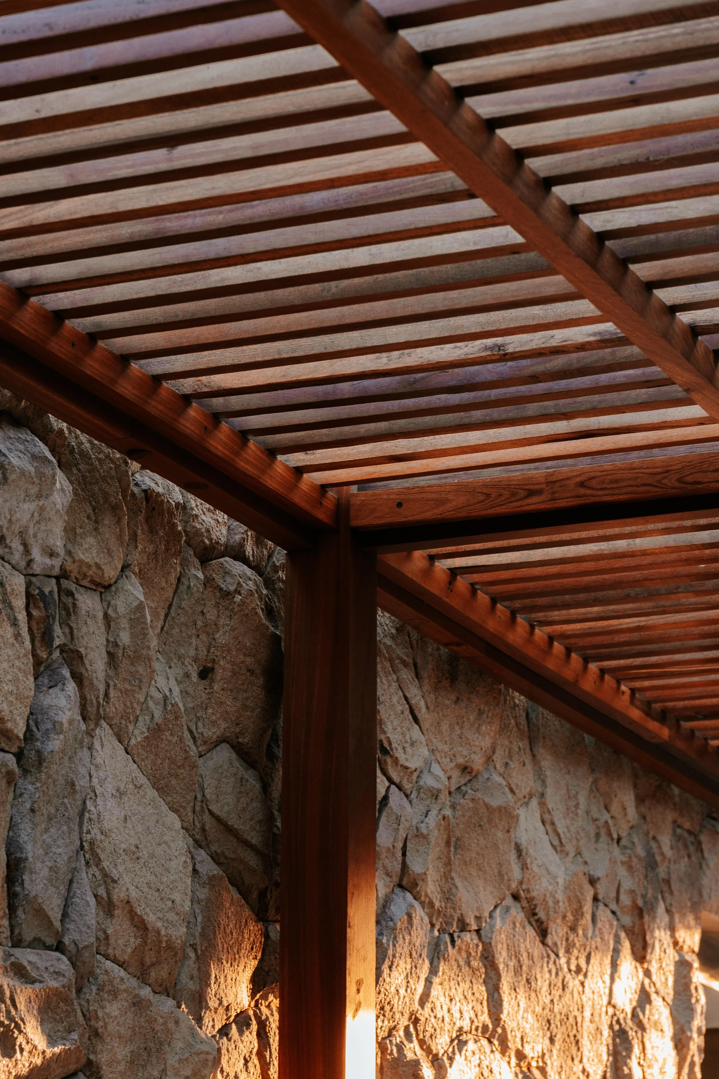 Timber and stone entrance details at Kalm Lembongan
