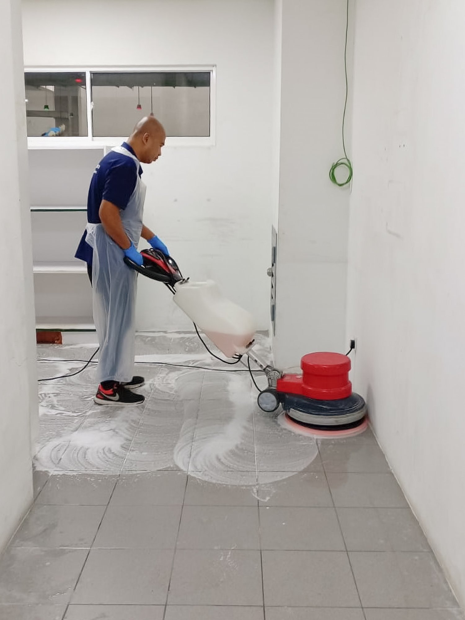 Professional floor scrubbing taking place in a  building in Brunei.
