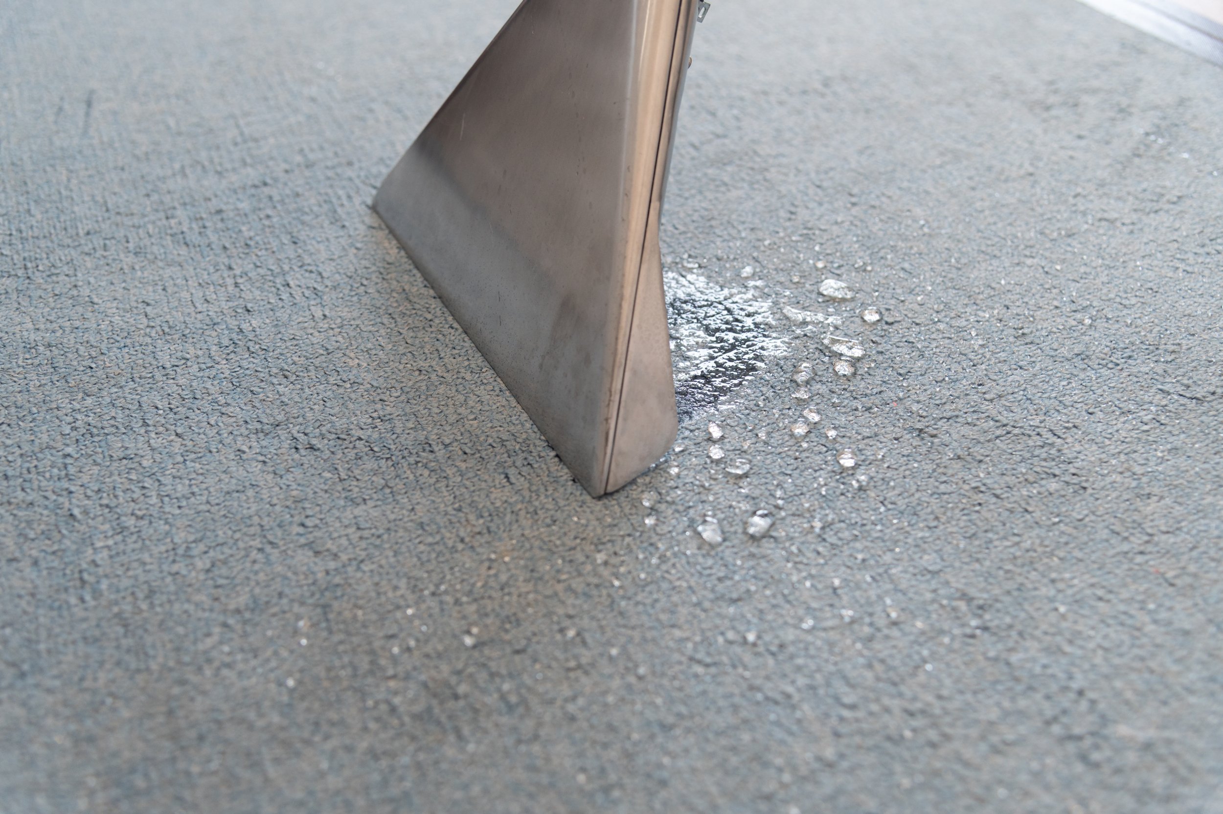 Professional carpet cleaning of spilled liquid with a carpet extraction machine in Brunei.