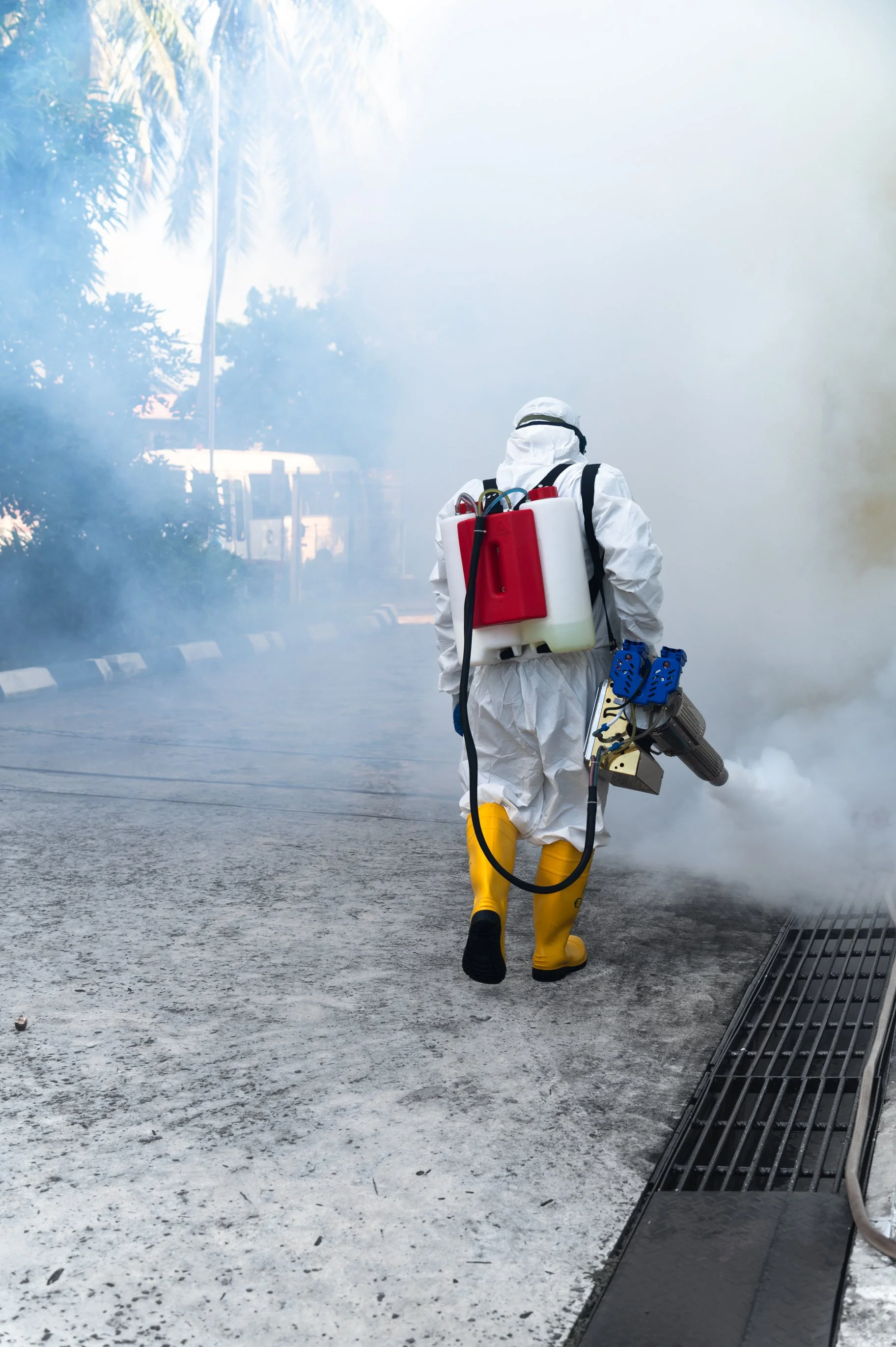 Professional mosquito fogging service carried out outdoors of a office building in Brunei.
