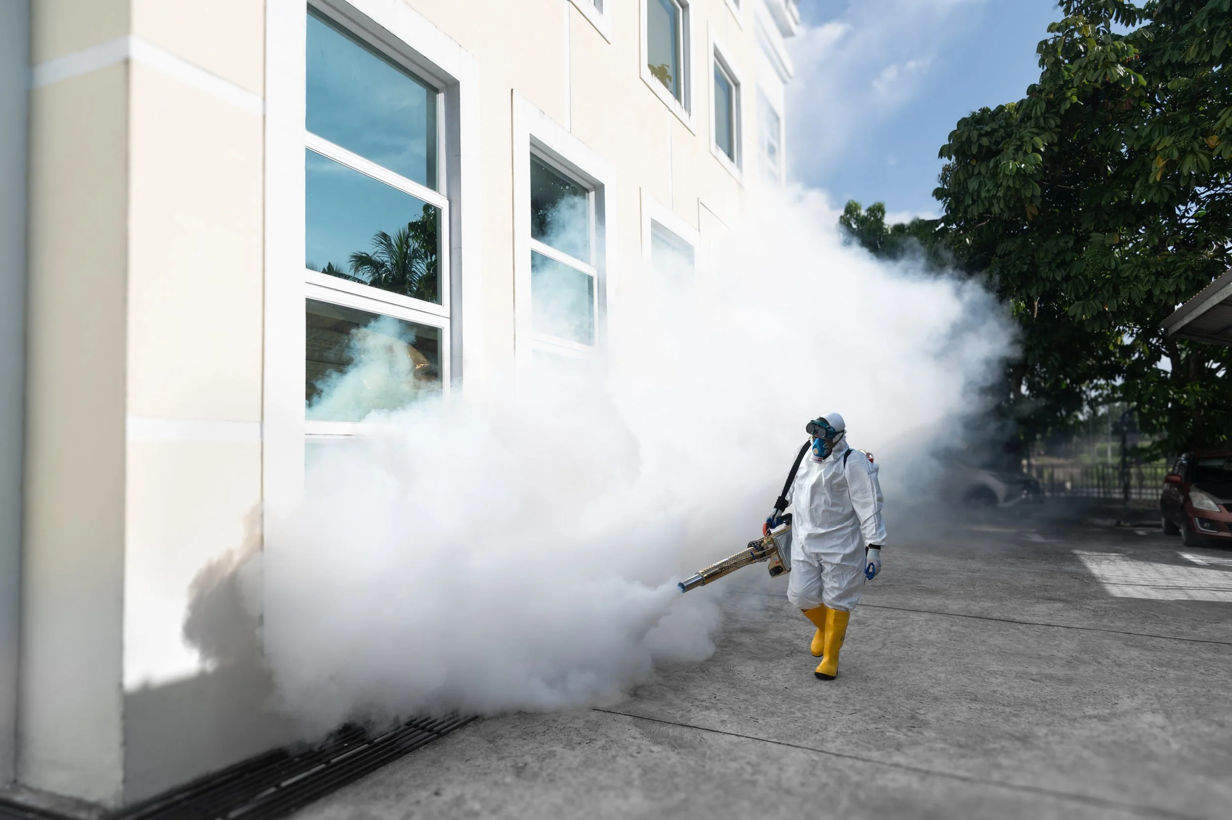 Professional mosquito fogging service carried out outdoors of a office building in Brunei.