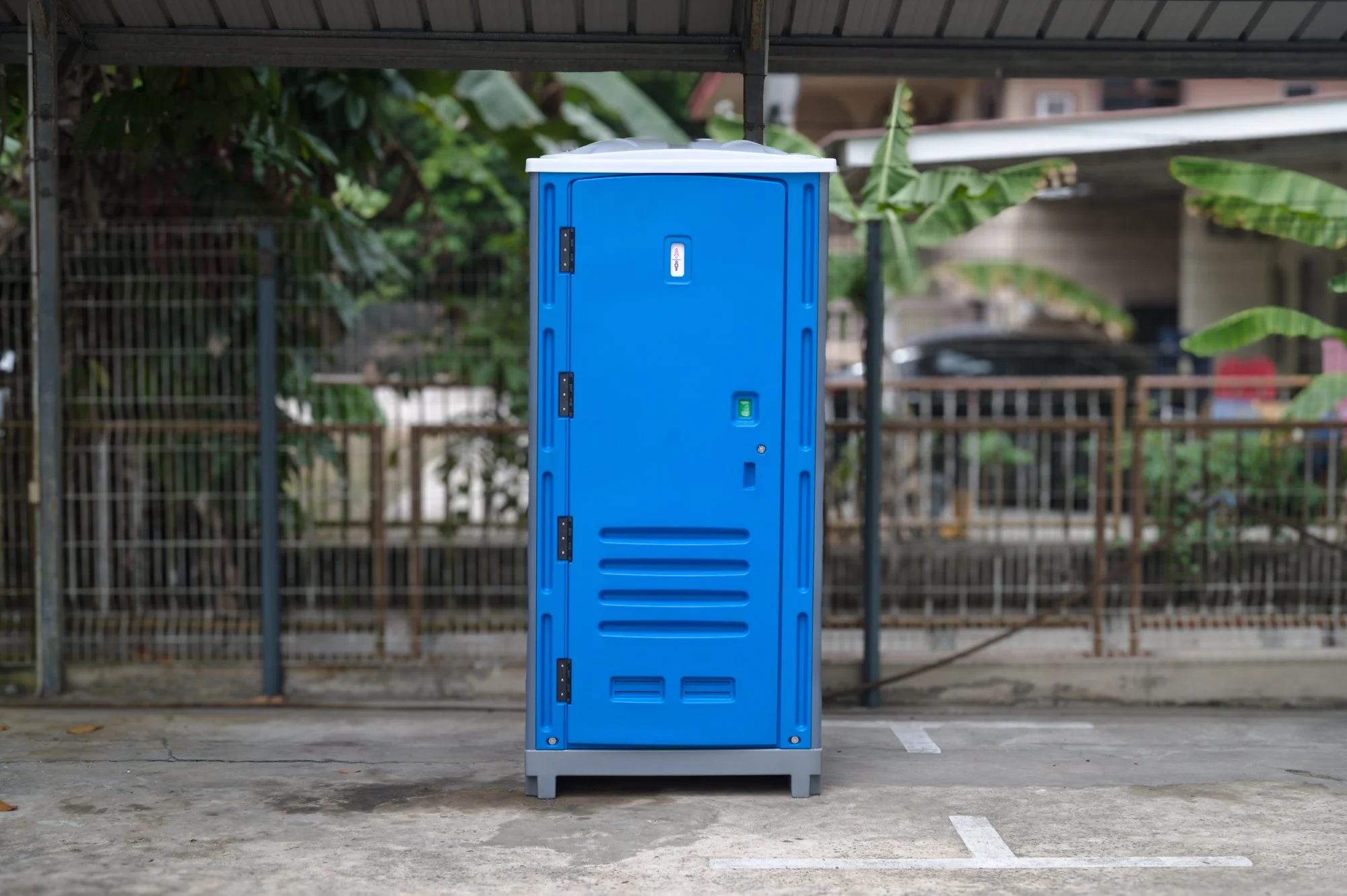 Full-service portable toilet rental delivery at an office in Brunei.