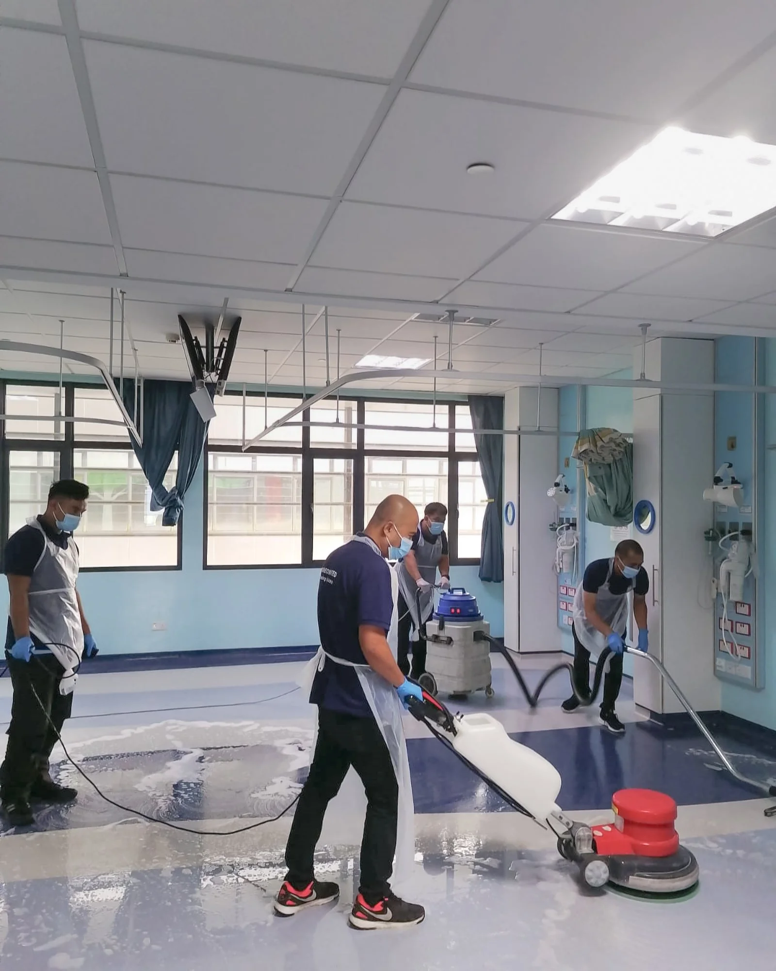 Professional floor polishing taking place in a  a hospital ward in Brunei.