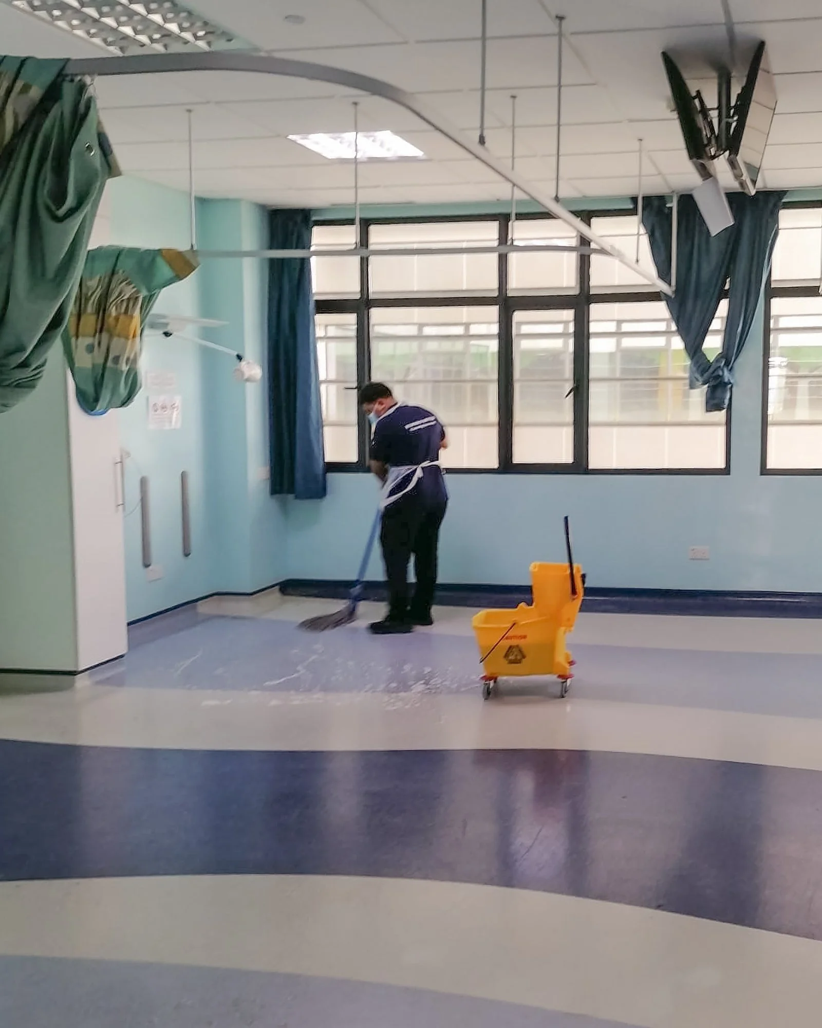 Professional floor cleaning taking place in a  a hospital ward in Brunei.