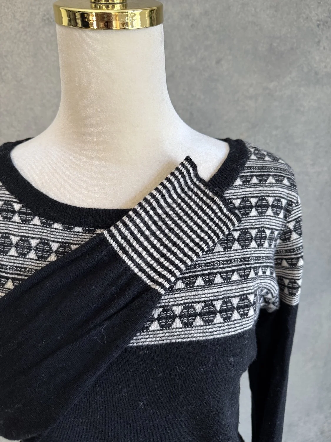 Sessún patterned yoke and striped sleeve cuff close-up on mannequin