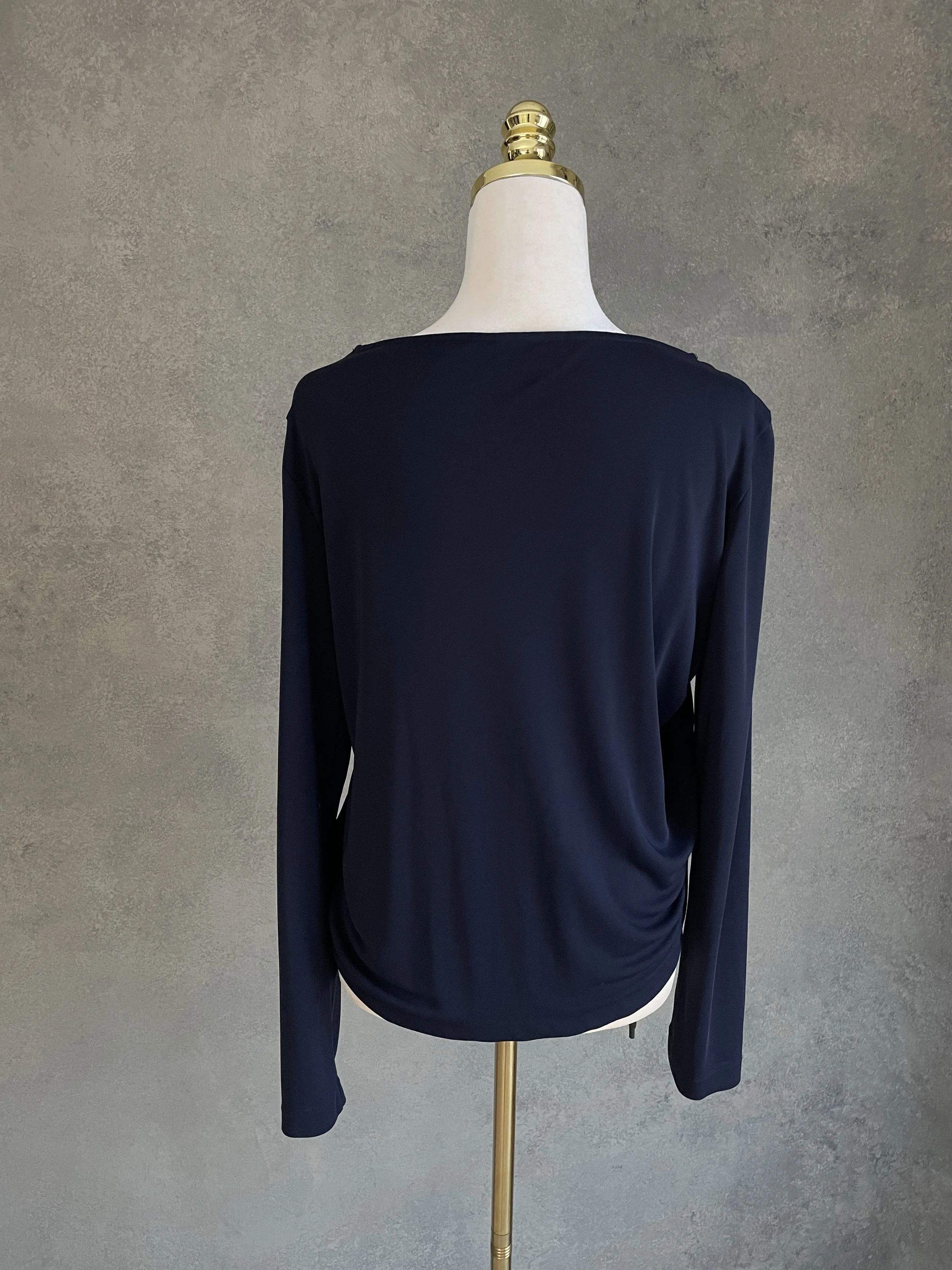 Rear view of the minimalist navy blue BLANCHE long-sleeve top.