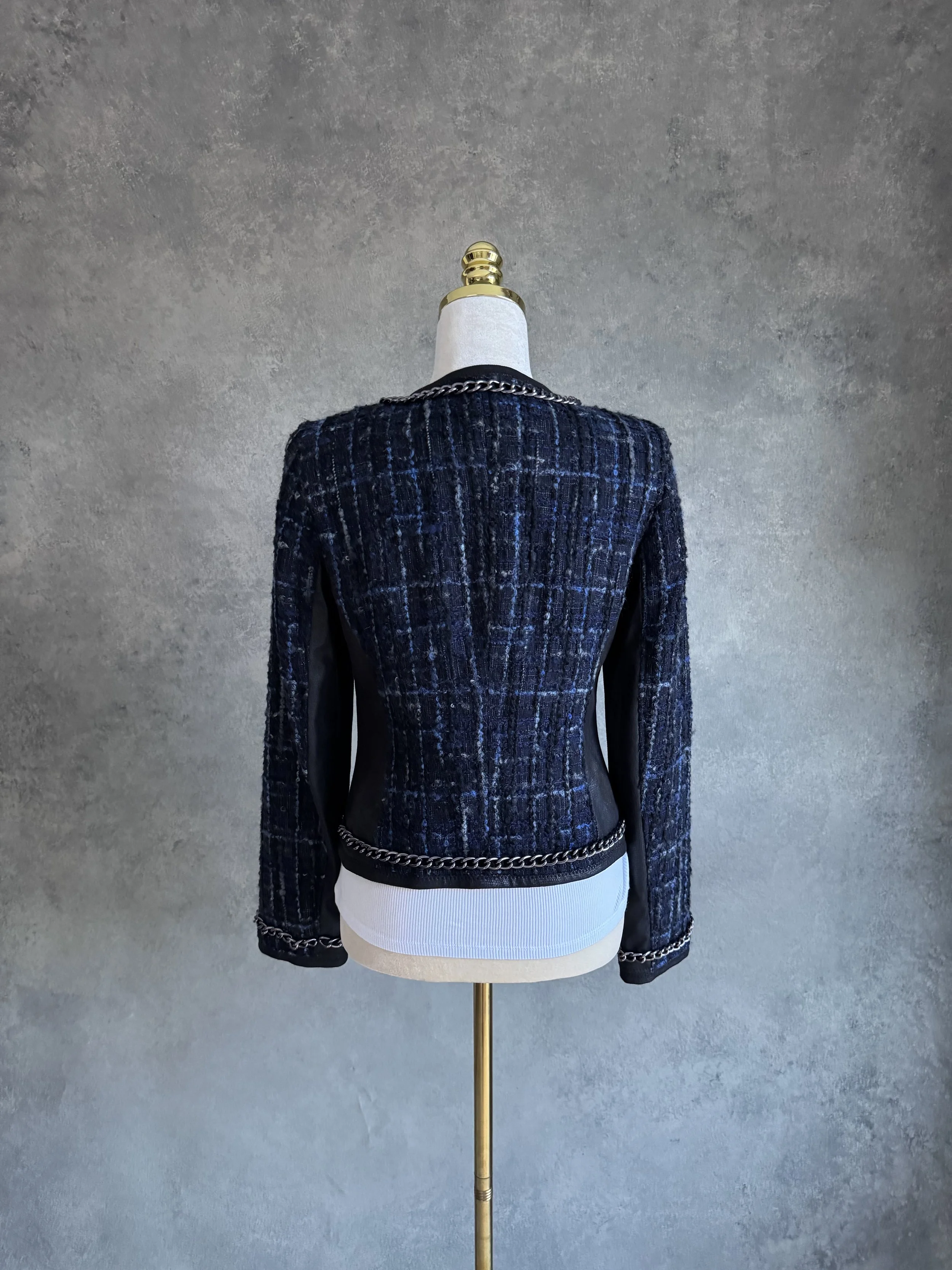 Full back view of the Riani blue tweed blazer on a mannequin.