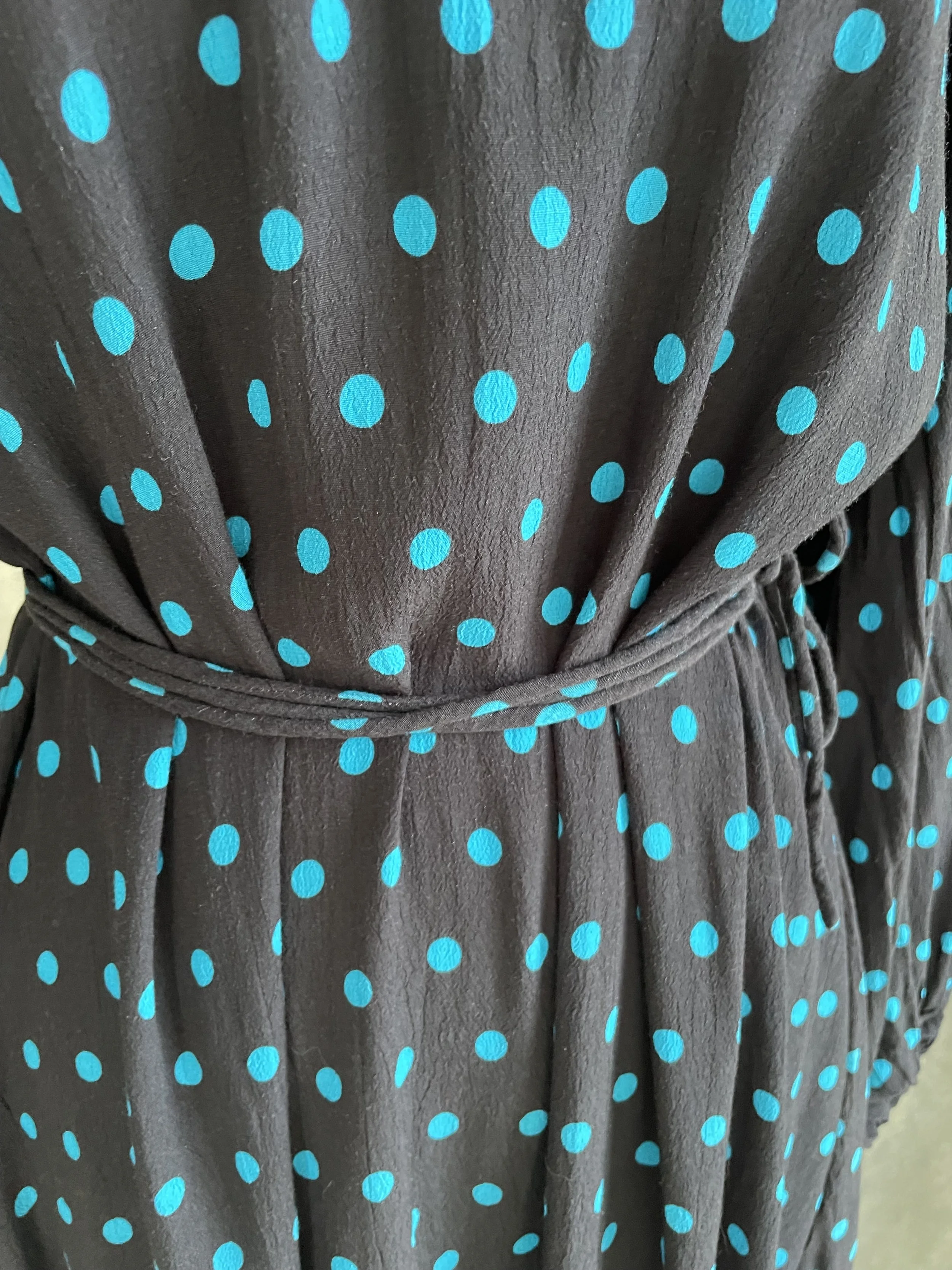 Focus on the waist tie detail of the Essentiel Antwerp dress.