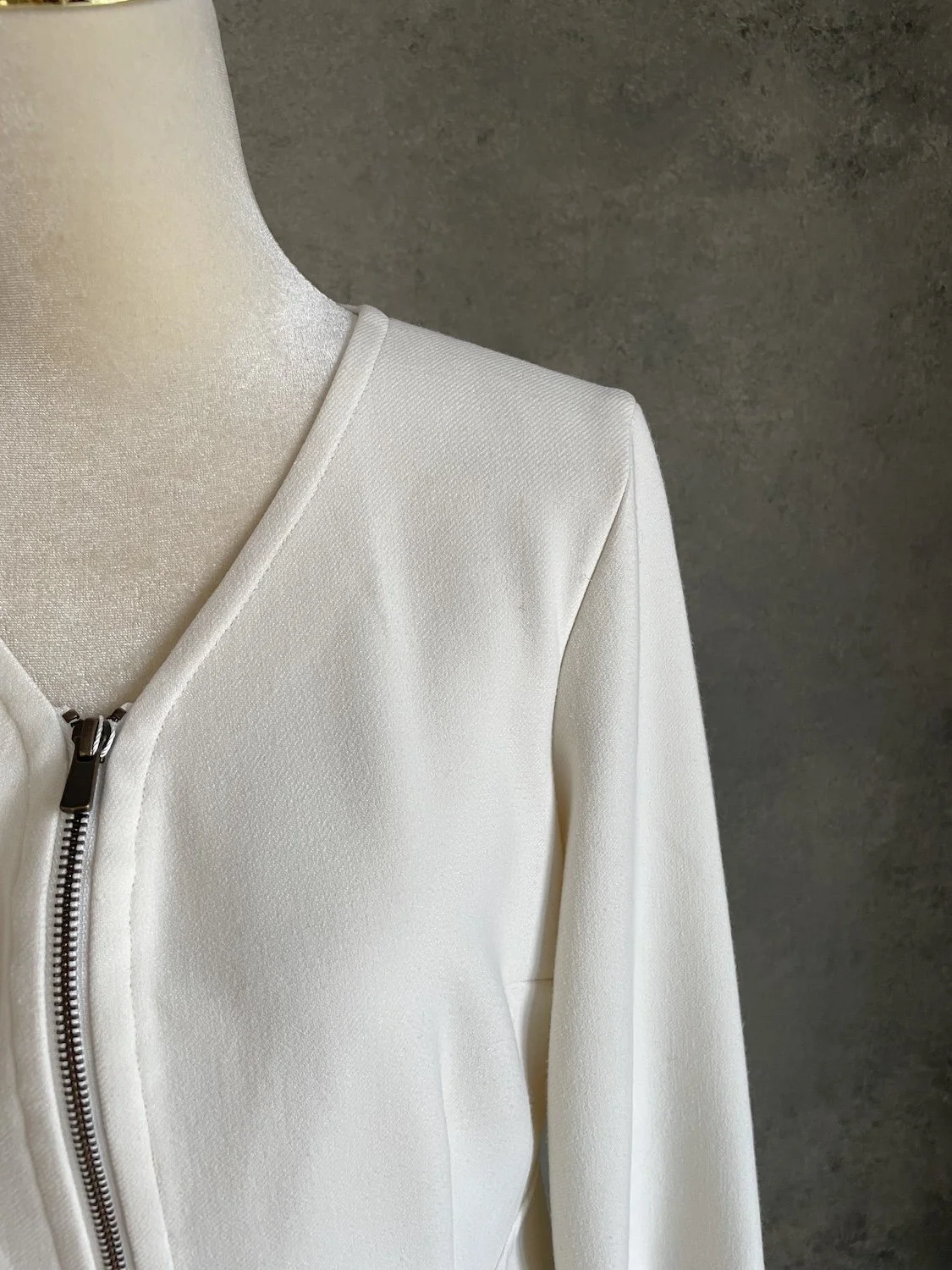 Gigue off-white dress neckline and front zipper close-up