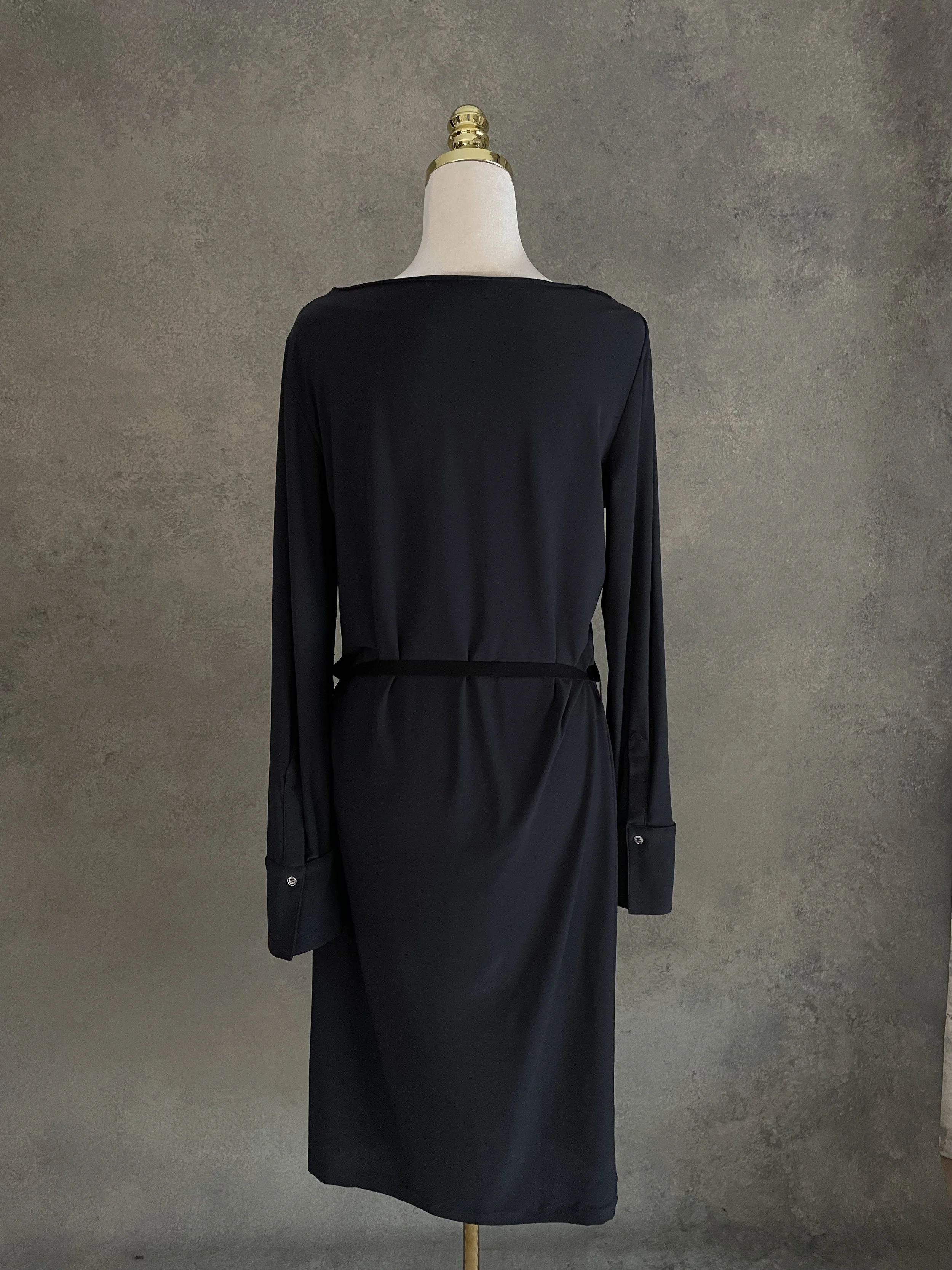 Back view of the anthracite midi dress, demonstrating its seamless, structured construction.