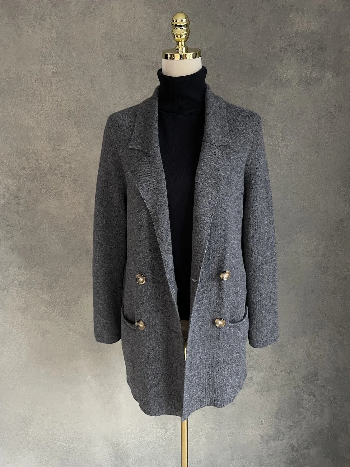 Front view of the cardigan worn open, displaying its relaxed drape and silhouette.