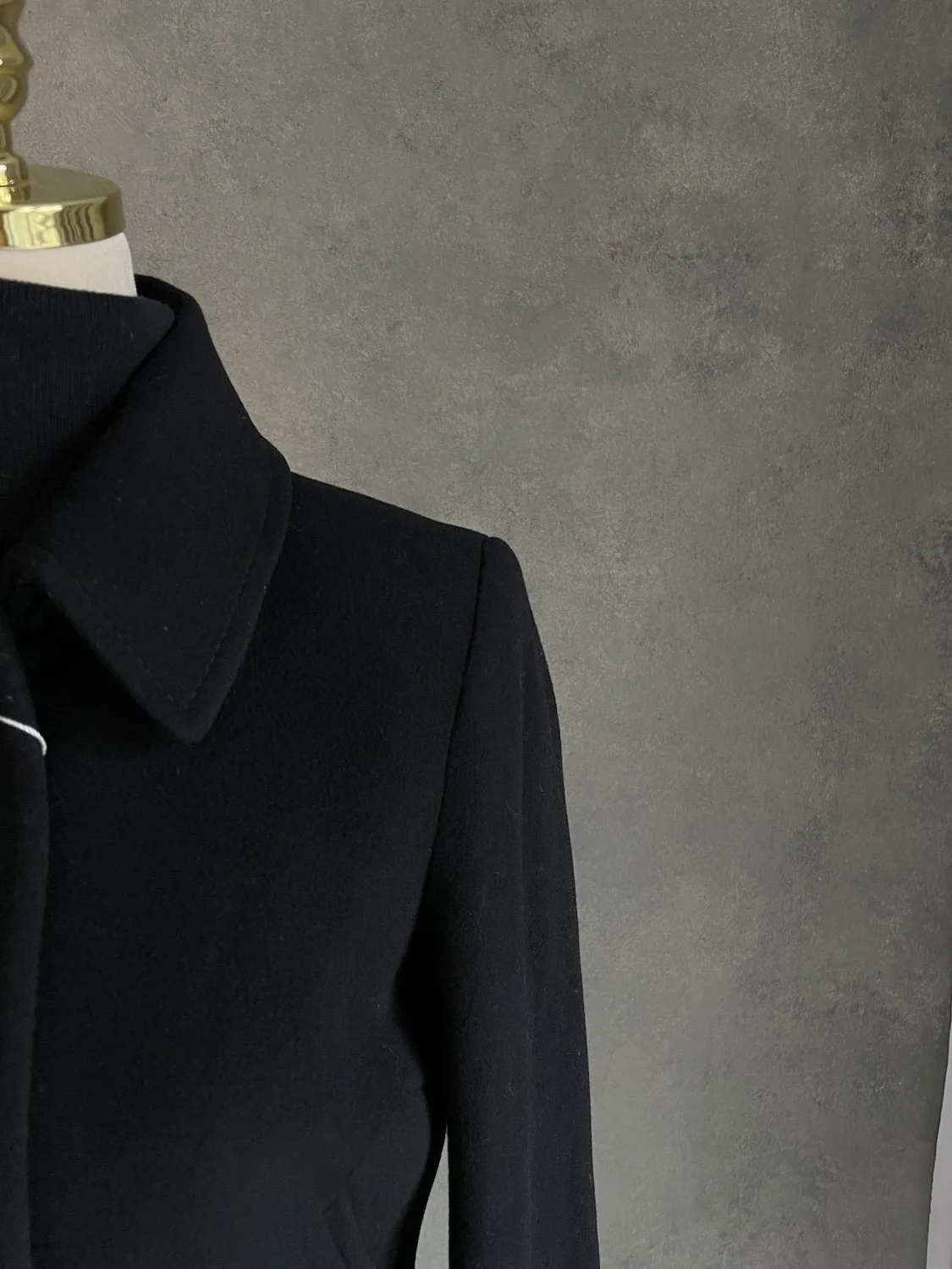 Scapa black coat lapel and shoulder close-up viewp