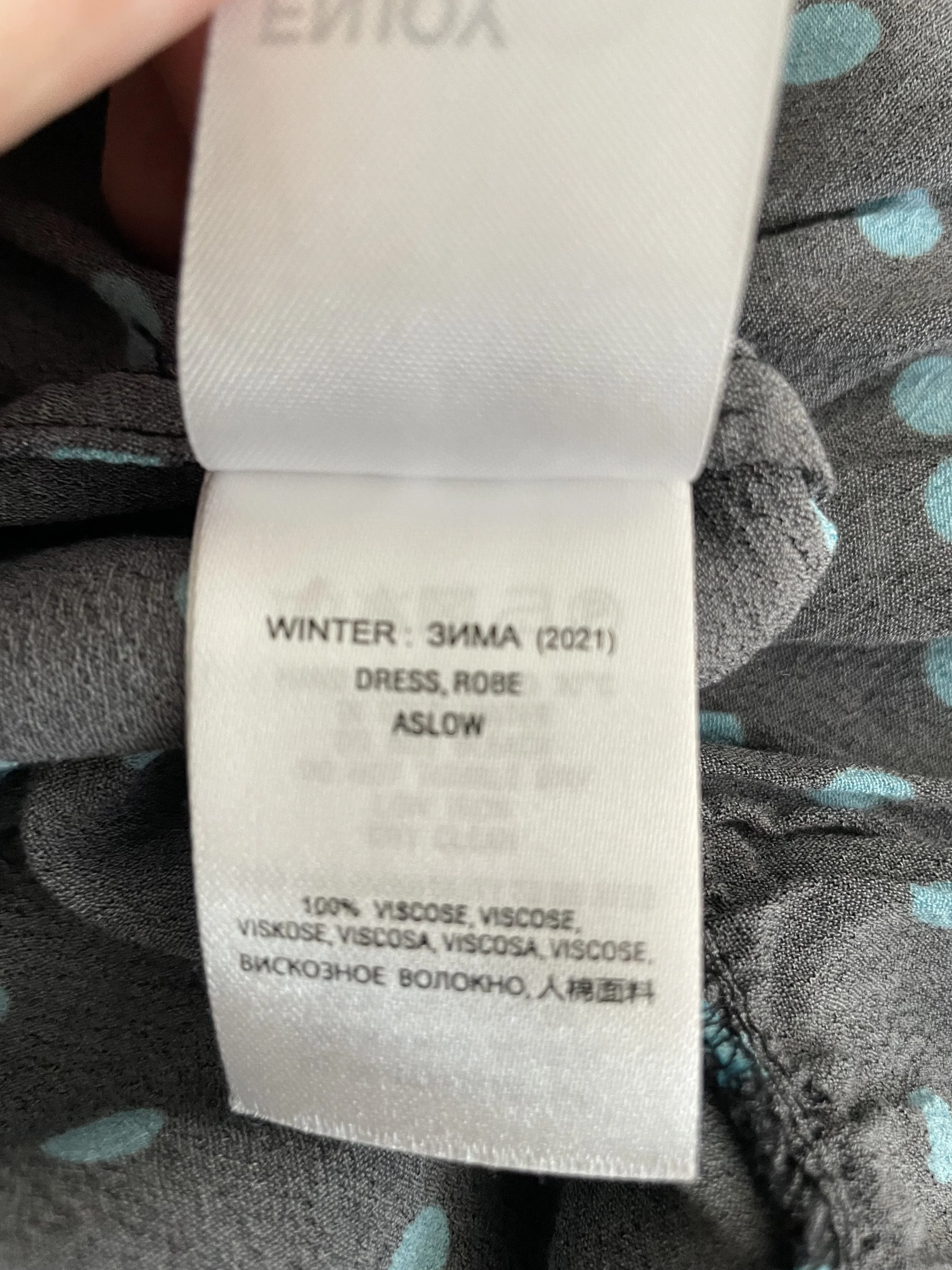 Close-up of the fabric and care label, indicating 100% viscose.