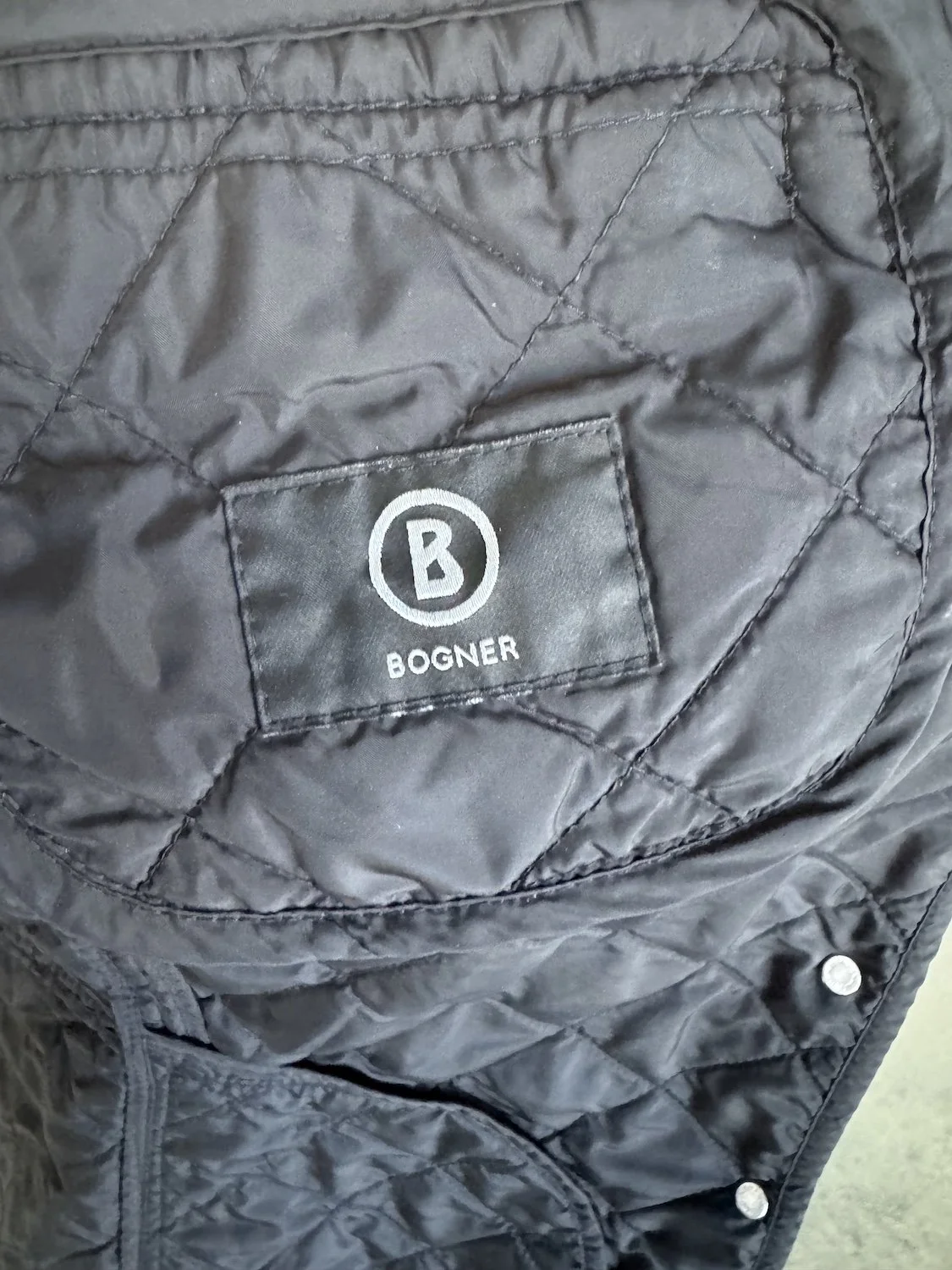 Bogner rubberized B logo interior brand patch on quilting