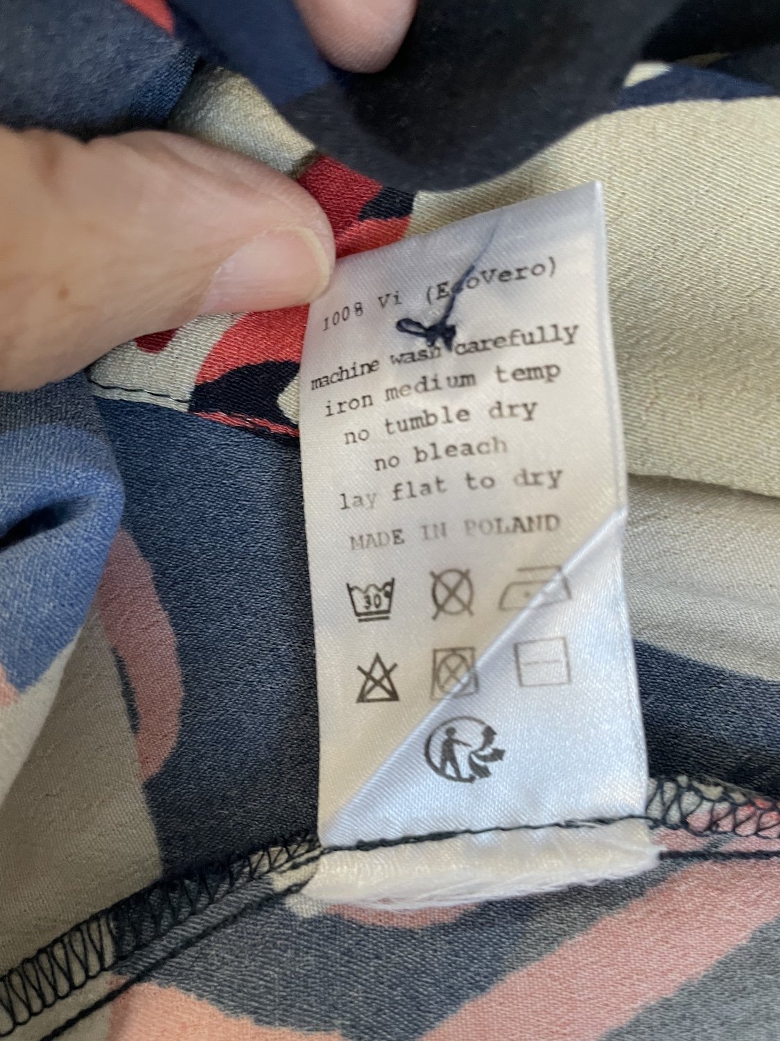 Nathalie Vleeschouwer care and composition label showing 100% EcoVero viscose made in Poland