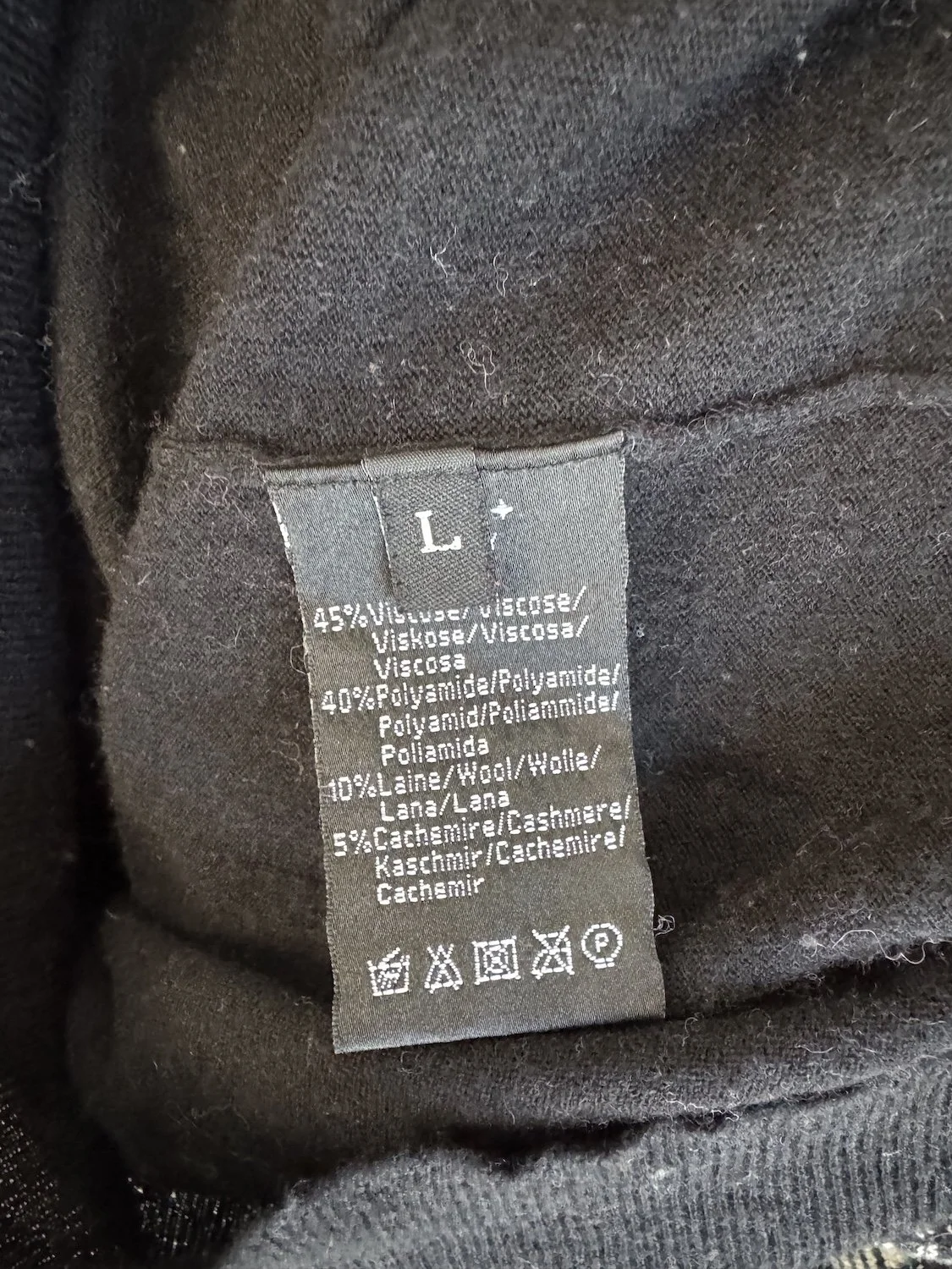 Sessún composition label showing 45% viscose 40% polyamide 10% wool 5% cashmere care instructions