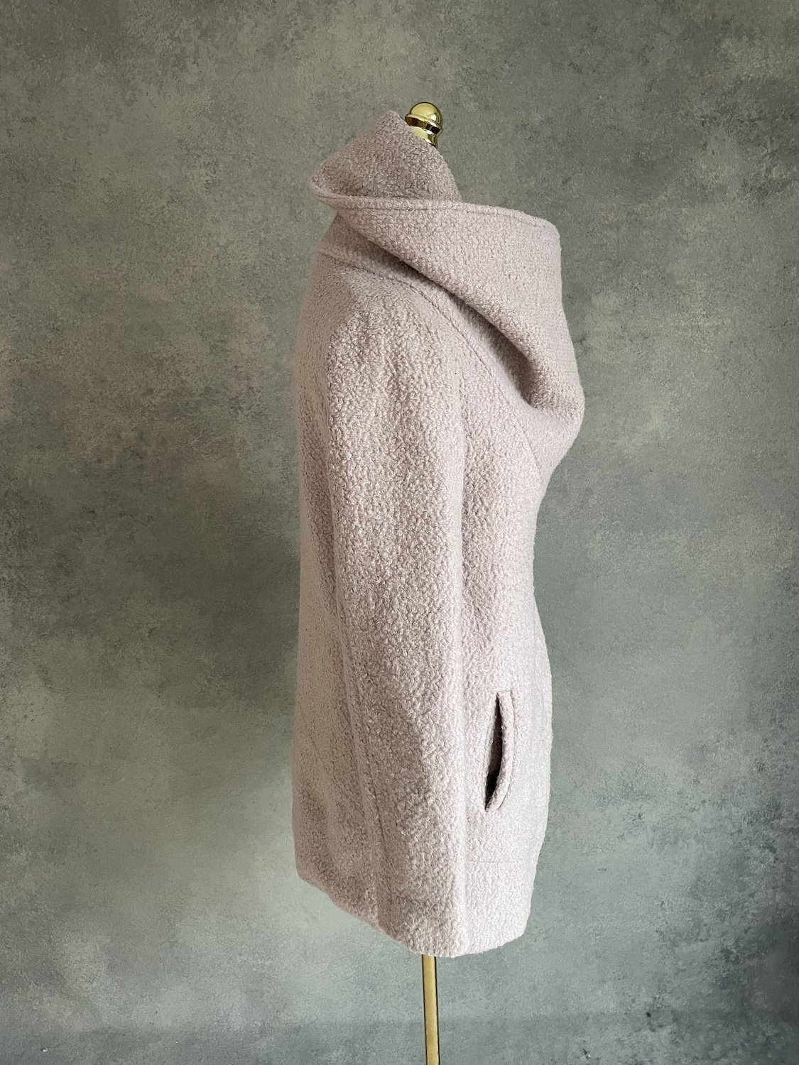 Side profile view showing mid-length silhouette and pocket placement.