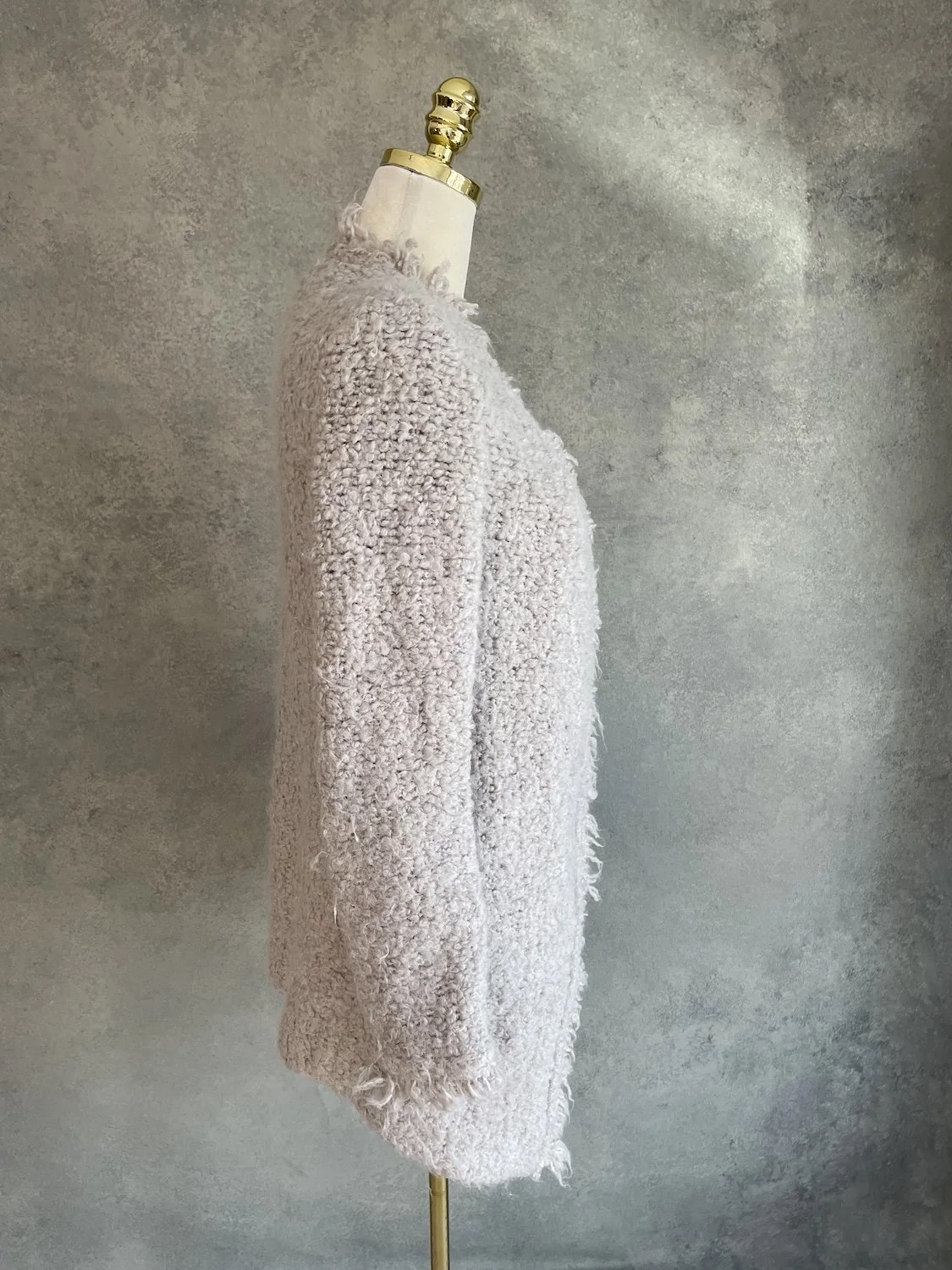 Side profile view of the IRO wool blazer on a mannequin, displaying the long sleeves and loose, comfortable fit.
