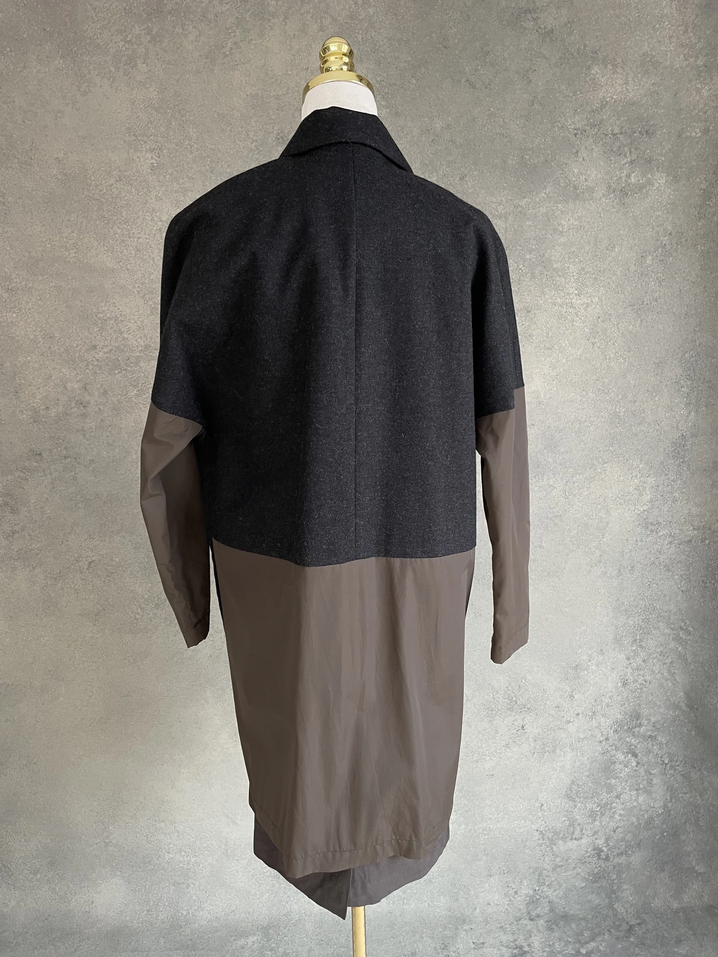 Back view of the Rue Blanche coat showing the two-tone color blocking.