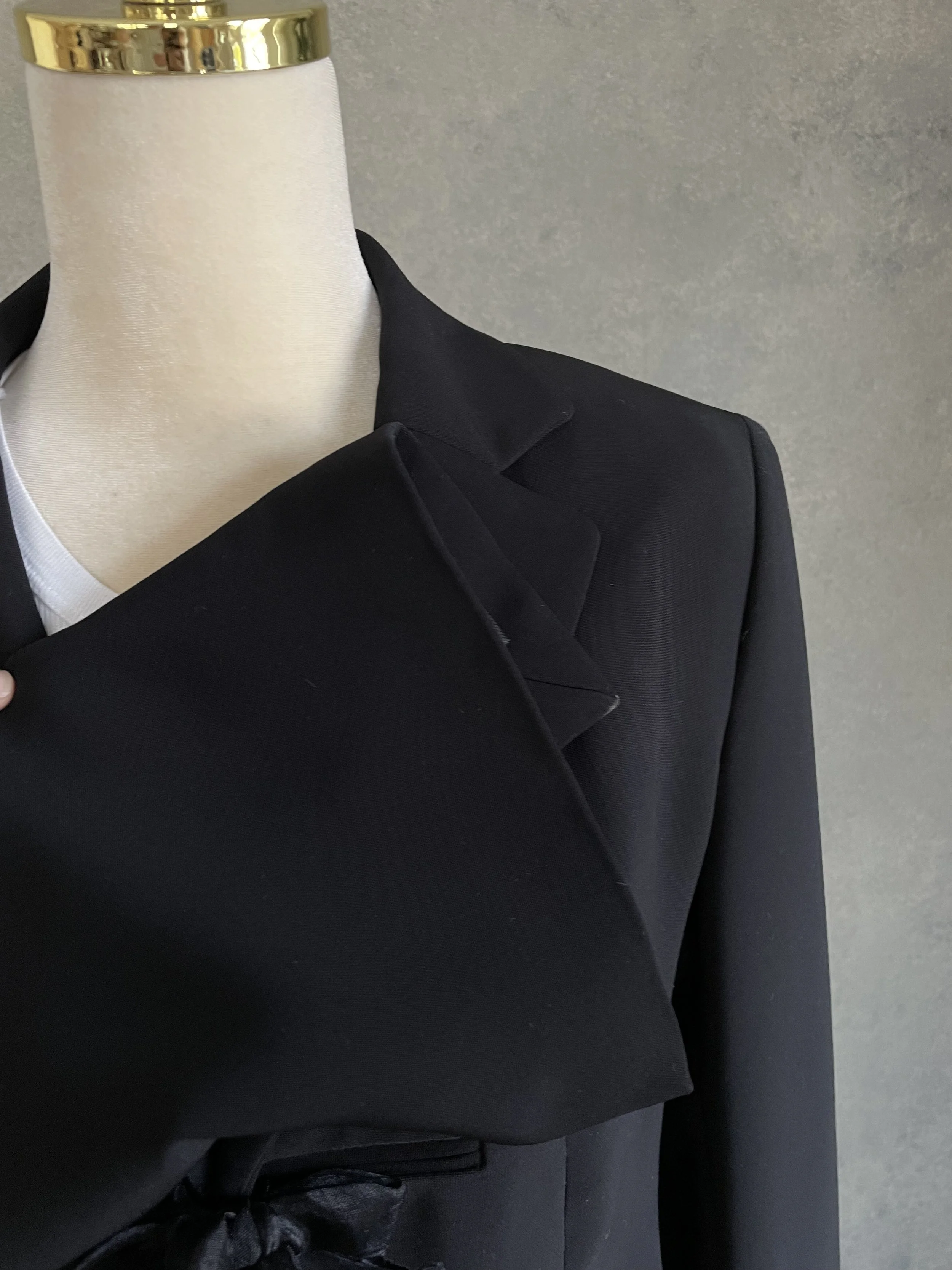 Close-up showing the sleevel and neckline of the Archie Pell blazer.