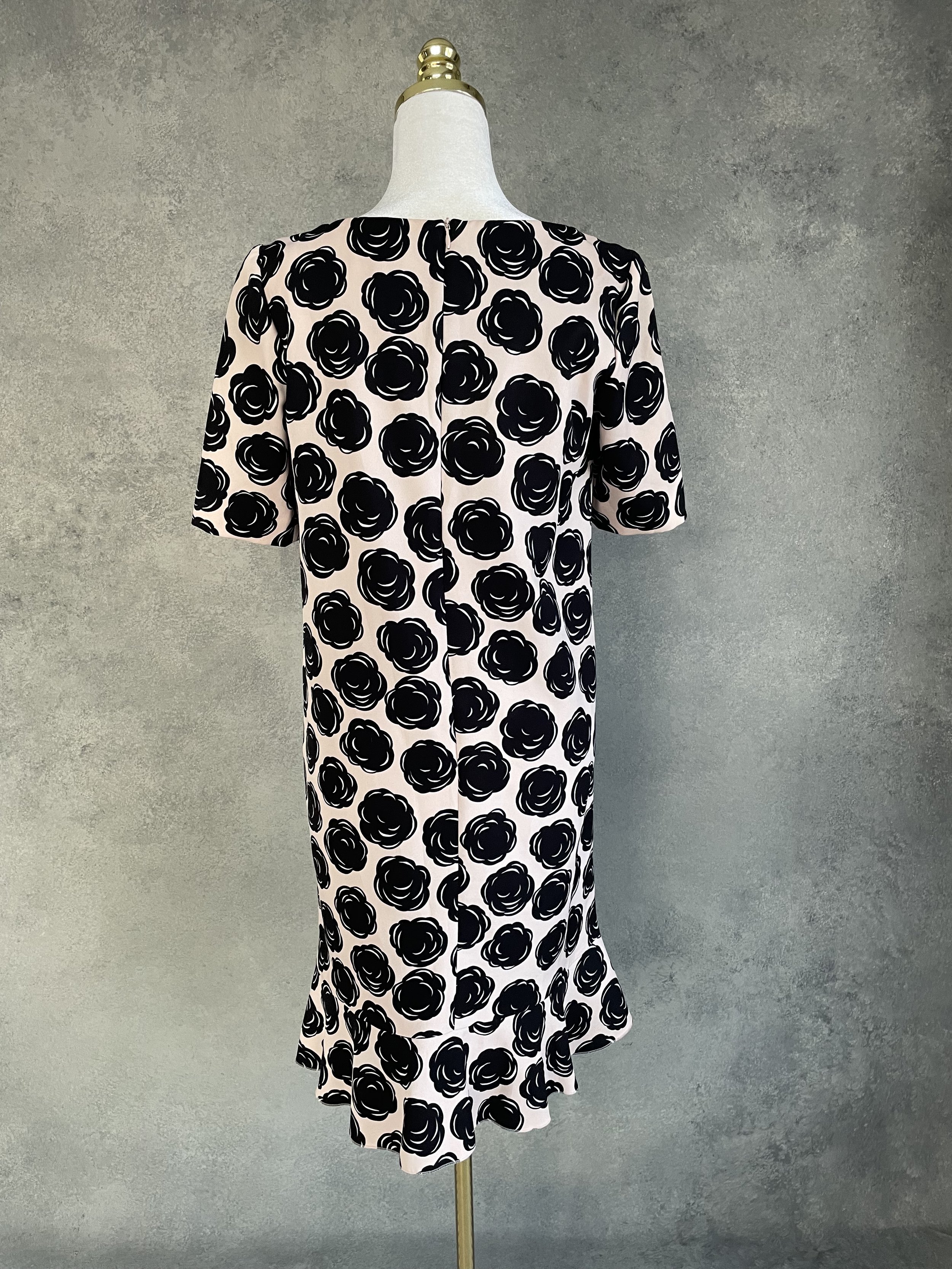 Full back view of the Gigue graphic floral dress, illustrating the clean drape and consistent pattern placement.
