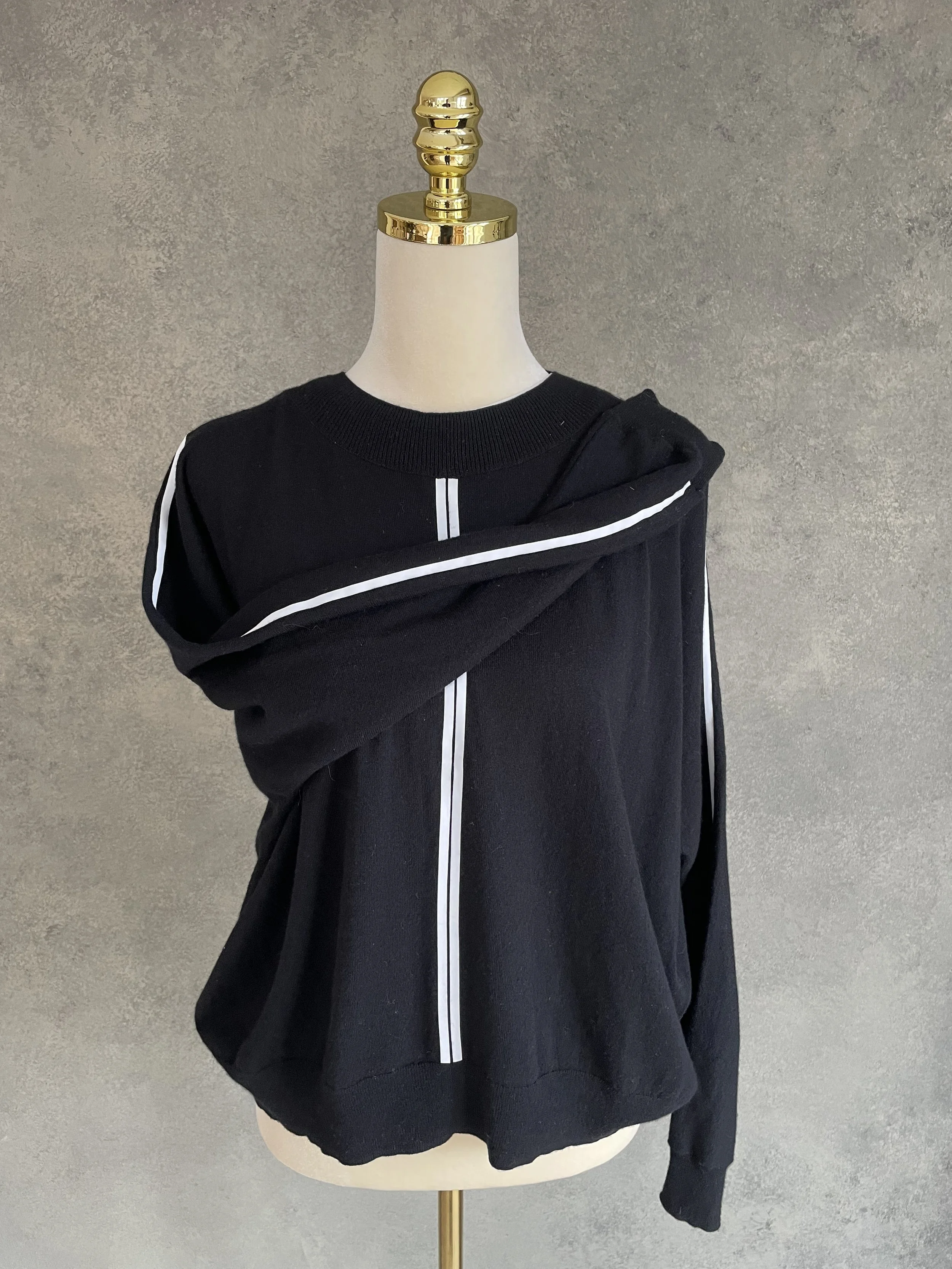Close-up of the Marc Cain jumper’s clean, refined neckline construction, highlighting the quality of the knit."