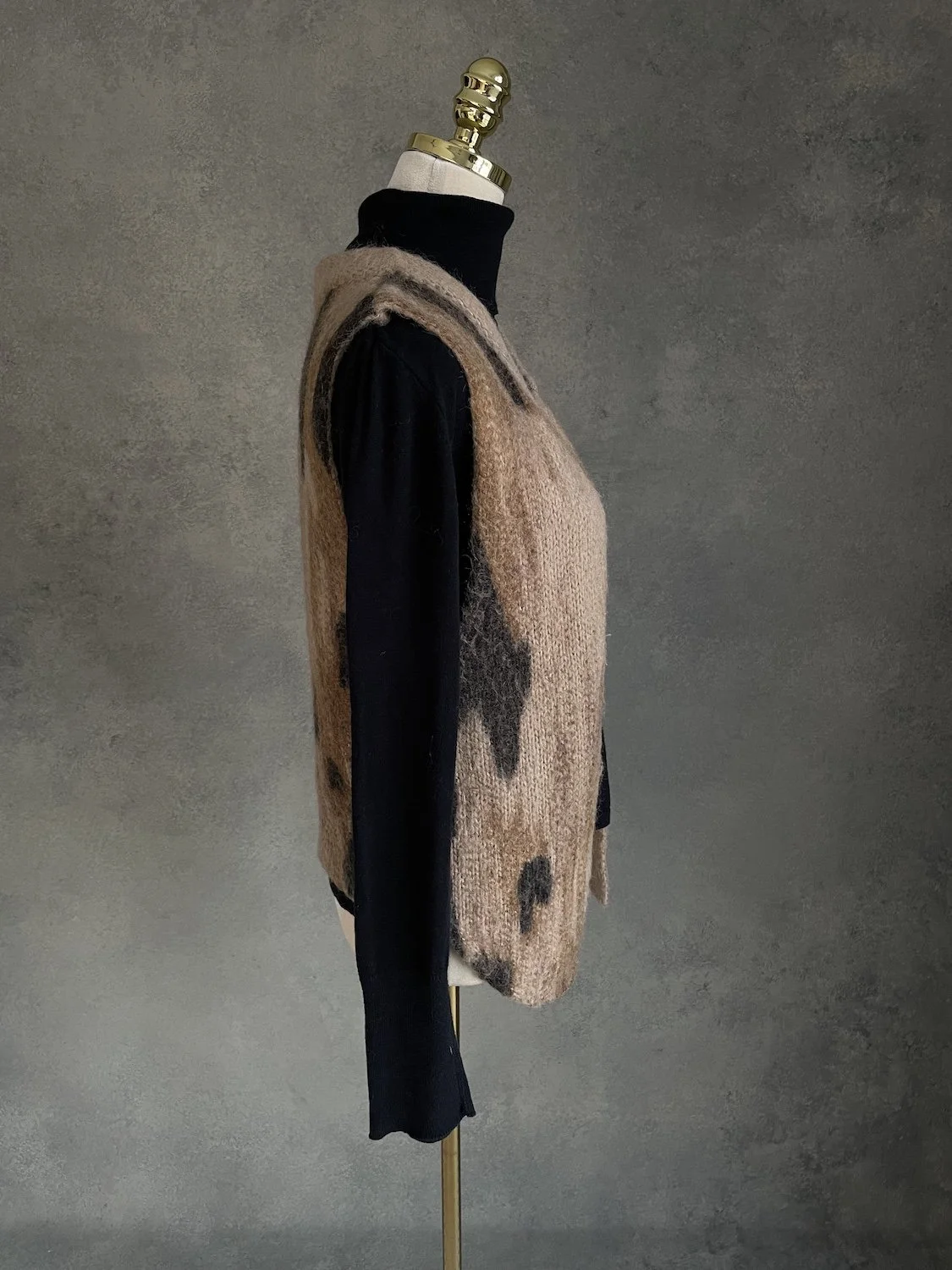 Side profile of 10 Feet mohair-wool mix vest on mannequin showing open front drape