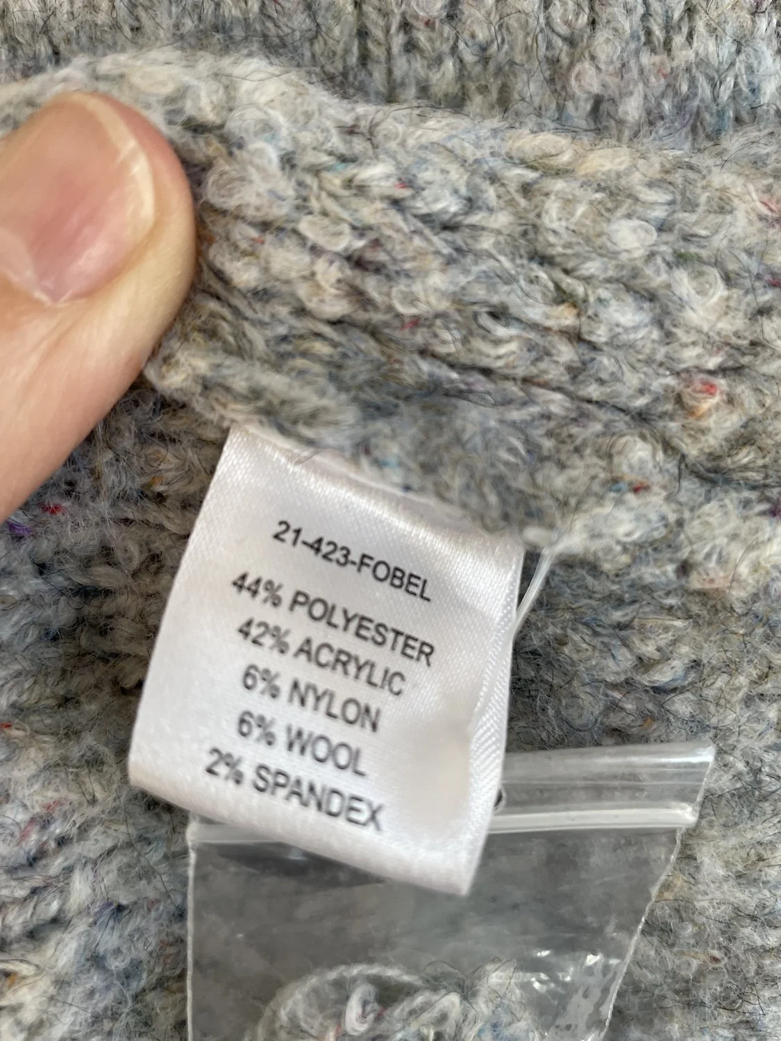 Macro shot of the fiber content label showing the detailed material composition breakdown.