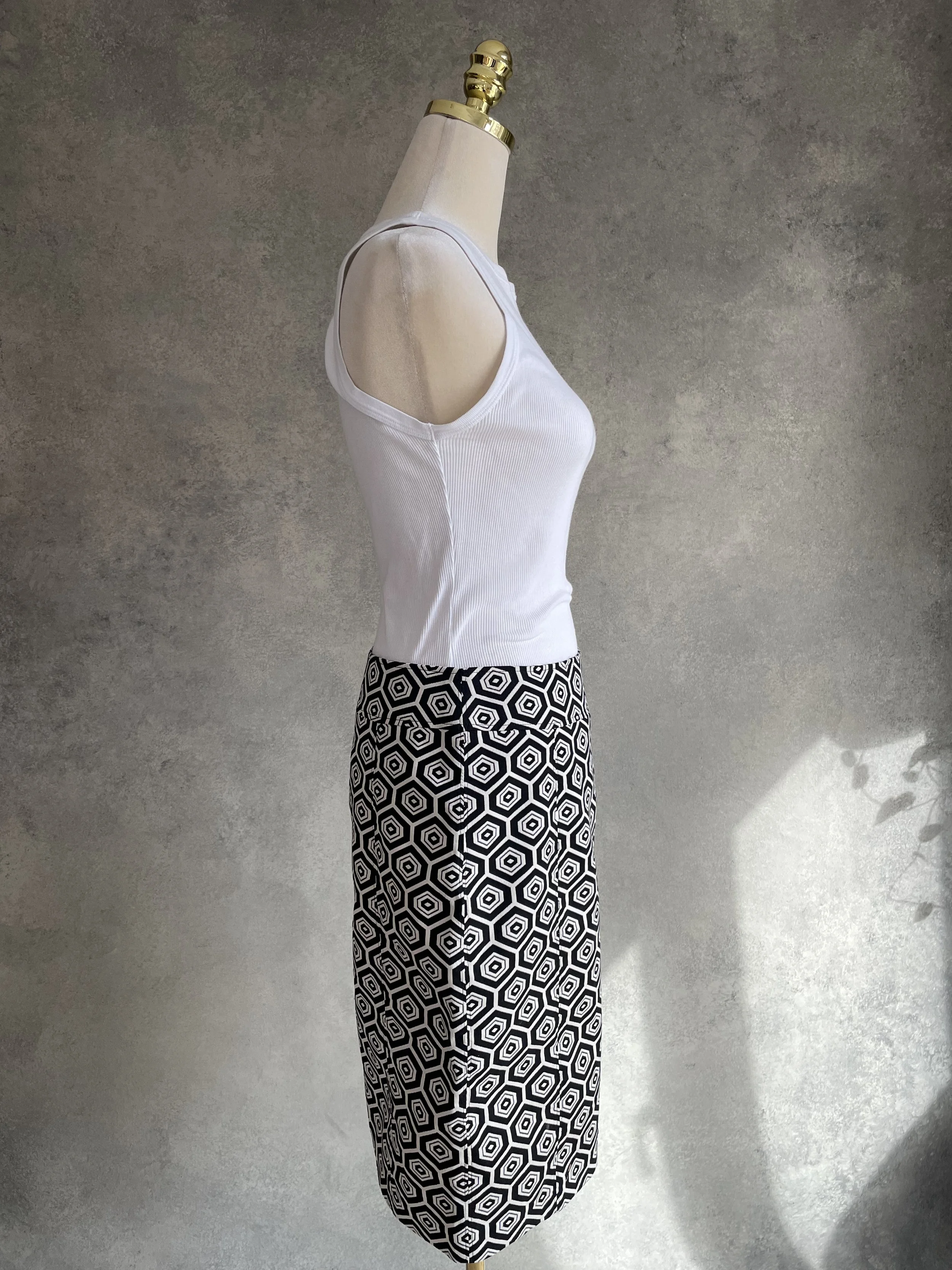 Side profile of the Caroline Biss pencil skirt showing tailored fit.